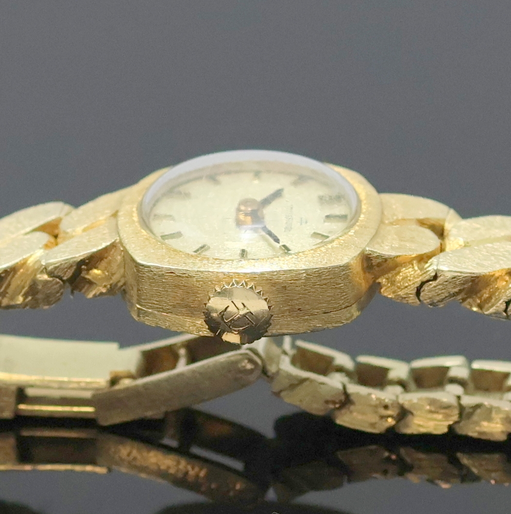 Detail c: TISSOT Damenarmbanduhr in GG 585/000, Schweiz um 1970, Handaufzug, 2-teil. viereckiges Geh. m. angesetzt. Gold- Gliederband m. Klappschl., gold. ...