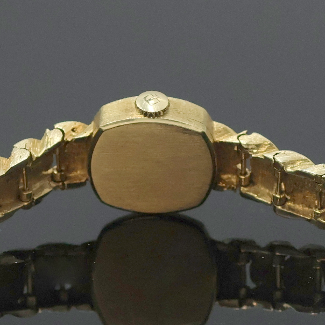Detail e: TISSOT Damenarmbanduhr in GG 585/000, Schweiz um 1970, Handaufzug, 2-teil. viereckiges Geh. m. angesetzt. Gold- Gliederband m. Klappschl., gold. ...
