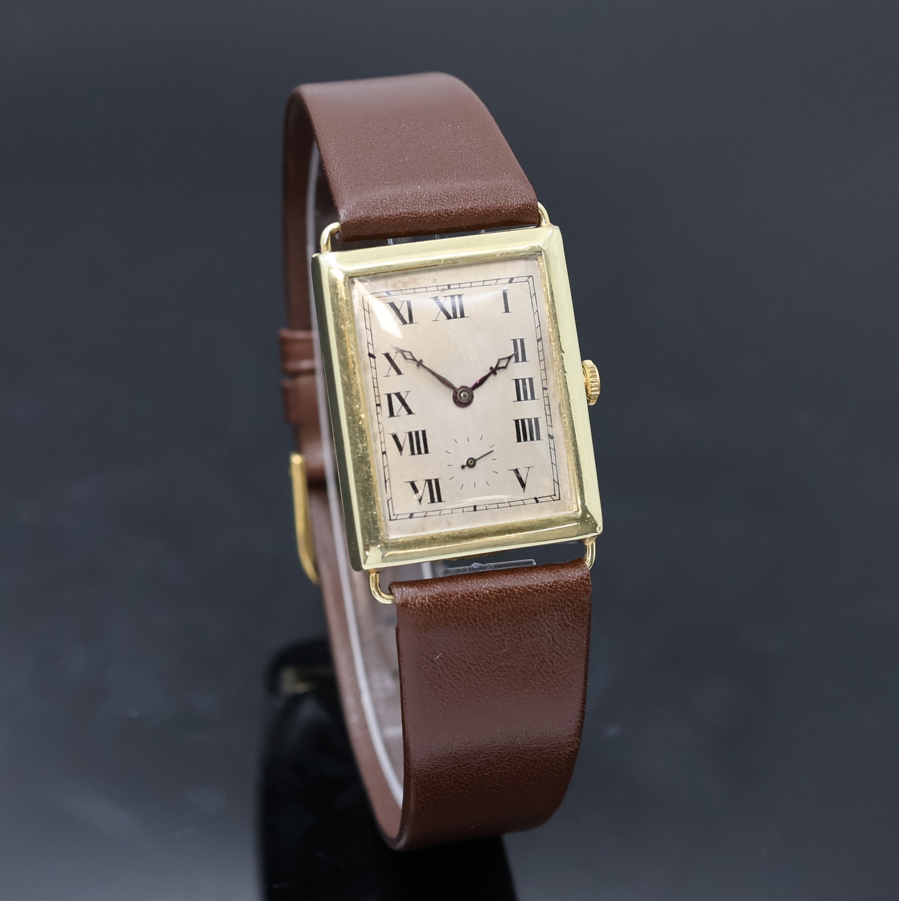 Detail b: ULYSSE NARDIN rechteckige Armbanduhr in GG 750/000, Schweiz um 1920, Handaufzug, Scharniergeh. m. festen Drahtanstößen, silb. Zifferbl. berieb., ...