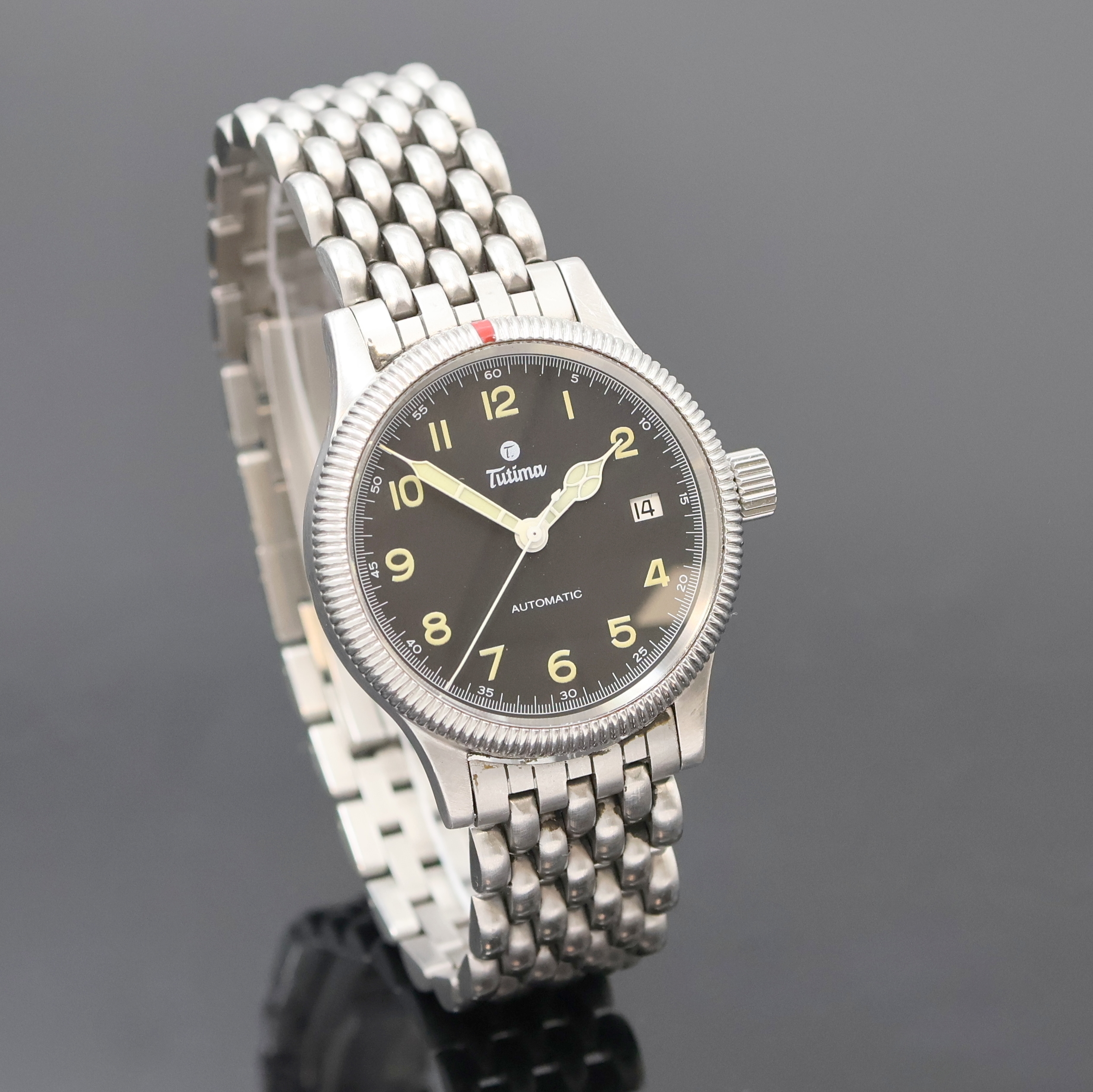 Detail b: TUTIMA Armbanduhr in Stahl, Deutschland um 1995, Automatik, orig. Gliederband m. dopp. Faltschl., Lün. beids. drehb., Boden u. Krone verschr., ...
