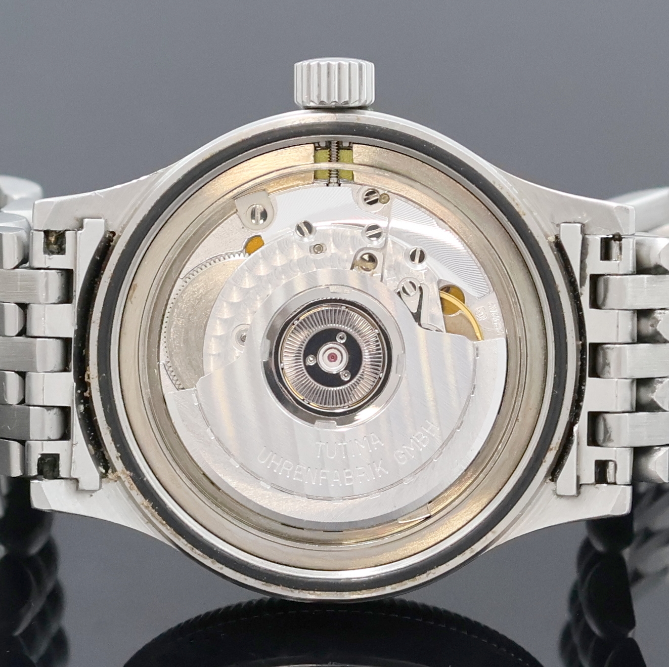 Detail g: TUTIMA Armbanduhr in Stahl, Deutschland um 1995, Automatik, orig. Gliederband m. dopp. Faltschl., Lün. beids. drehb., Boden u. Krone verschr., ...