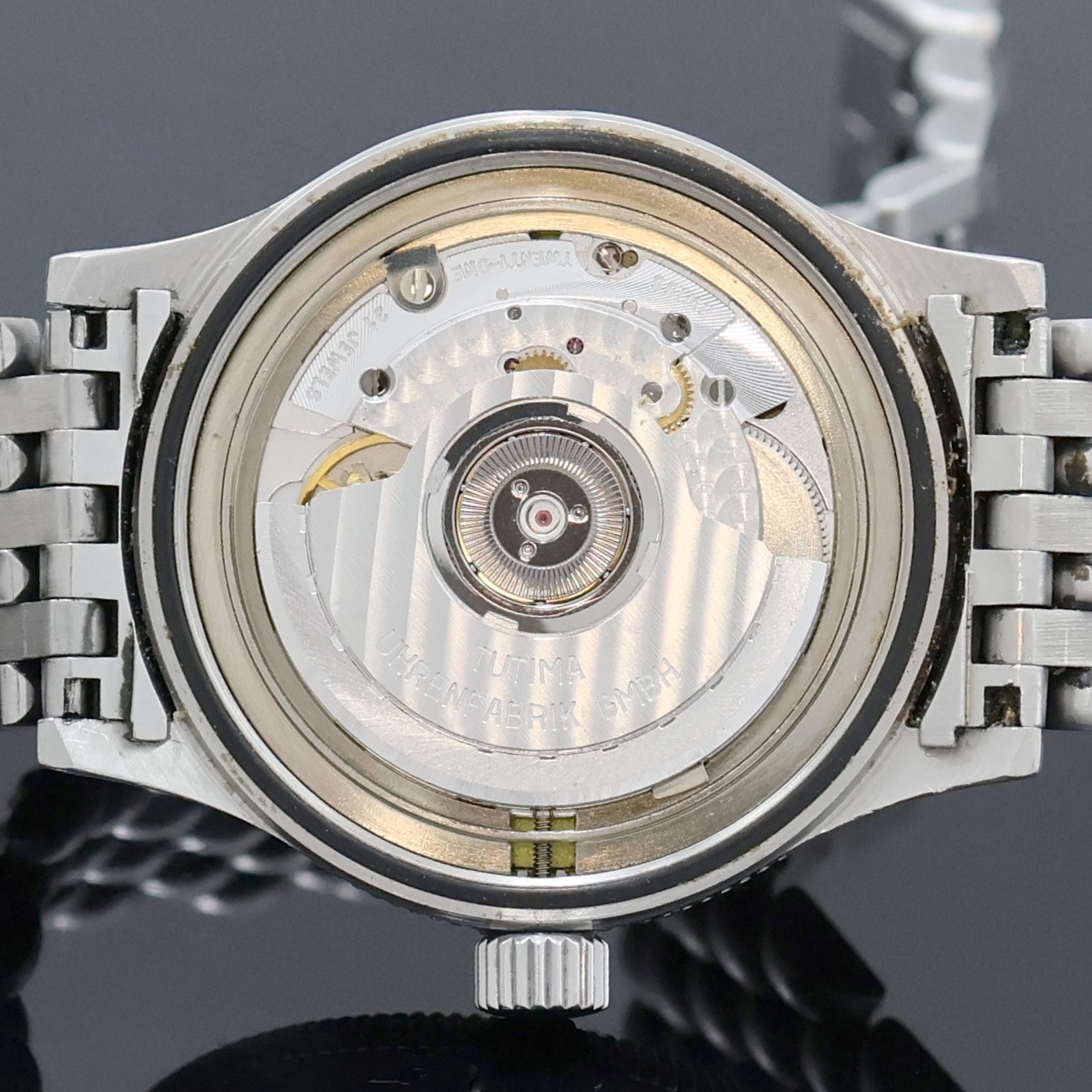 Detail h: TUTIMA Armbanduhr in Stahl, Deutschland um 1995, Automatik, orig. Gliederband m. dopp. Faltschl., Lün. beids. drehb., Boden u. Krone verschr., ...