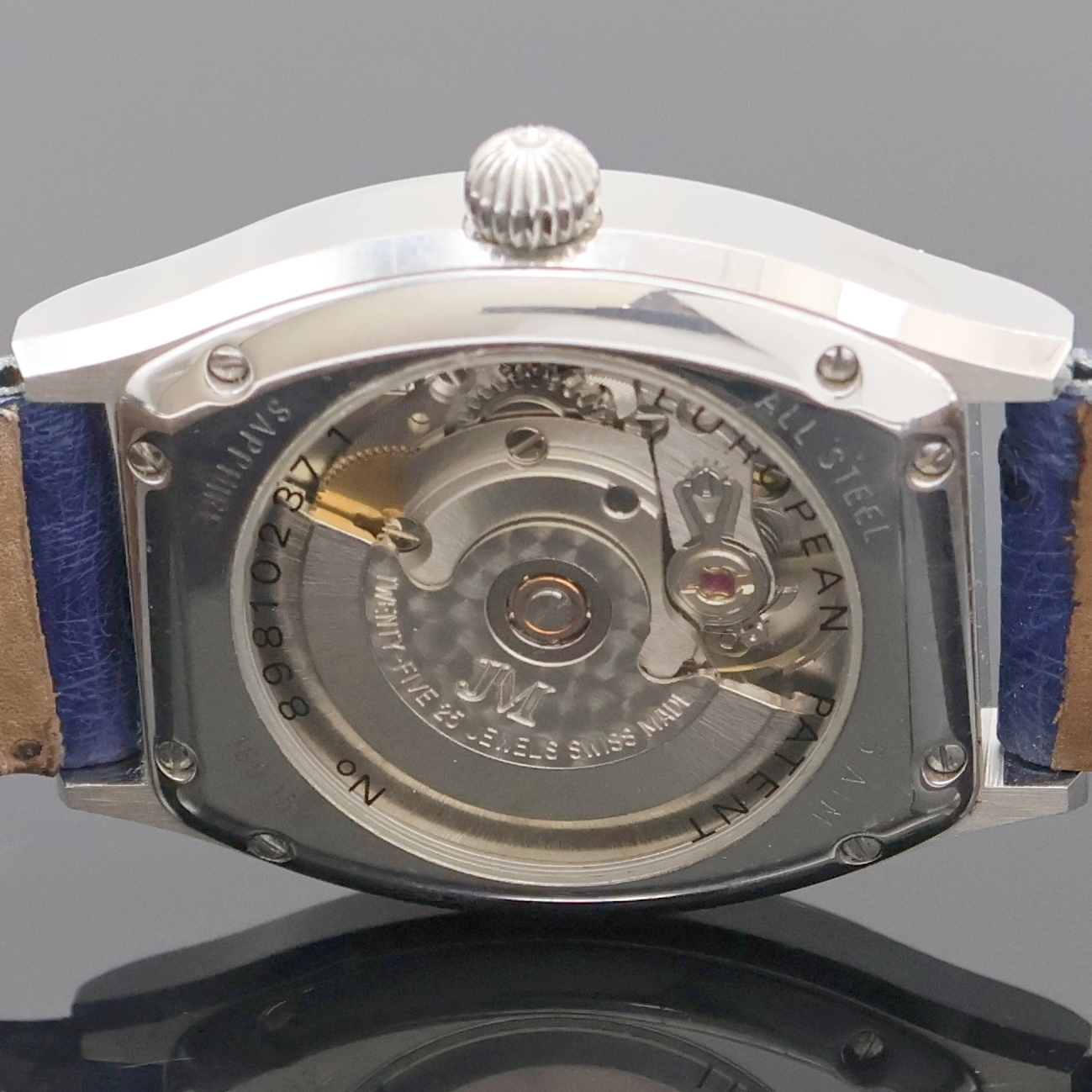 Detail e: JEAN MARCEL Herrenarmbanduhr mit wandernder springender Stunde Referenz 160.158, Schweiz um 1995, Automatik, tonneauförmiges, beids. vergl. ...