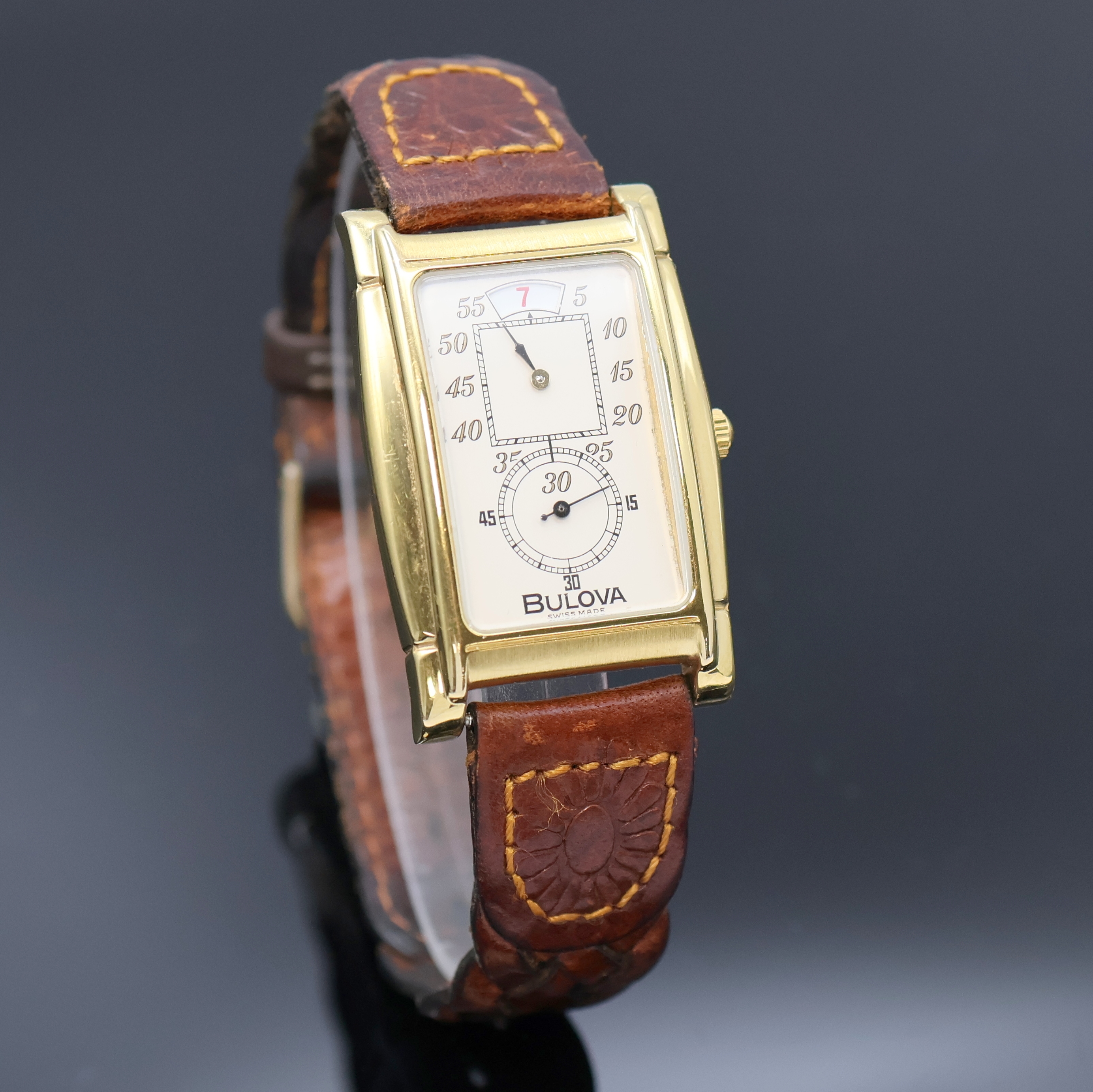 Detail b: BULOVA vergoldete Armbanduhr mit springender Stunde Referenz 8.098.1.0.10, Schweiz um 1990, Handaufzug, beids. vergl. Geh., Stahlboden aufgedr., ...