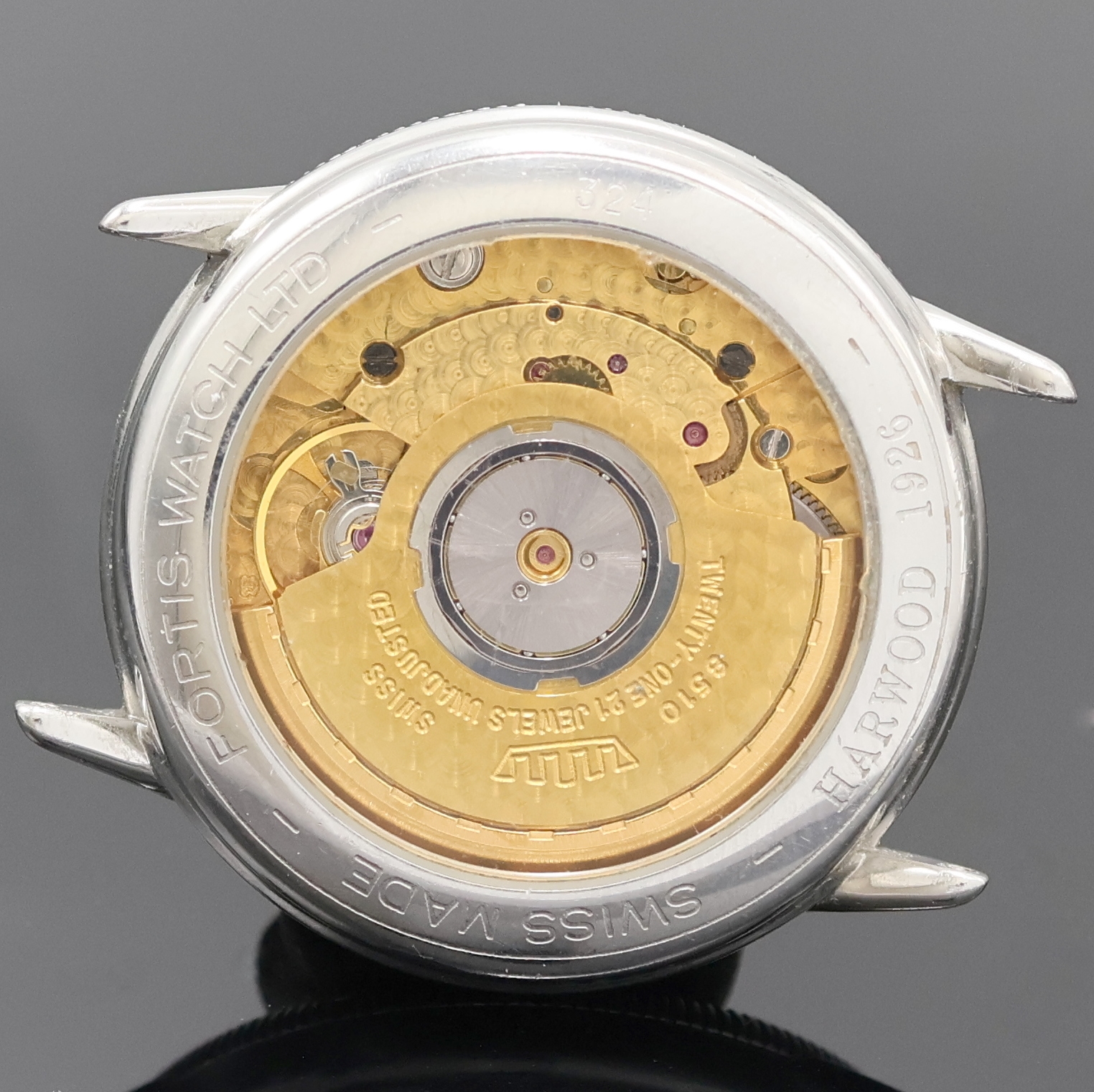 Detail d: HARWOOD / FORTIS Armbanduhr in Stahl, Schweiz um 1990, beids. vergl. Geh., Boden aufgedr., Zeigerstellung patent. v. Harwood 1926 durch drehen der ...