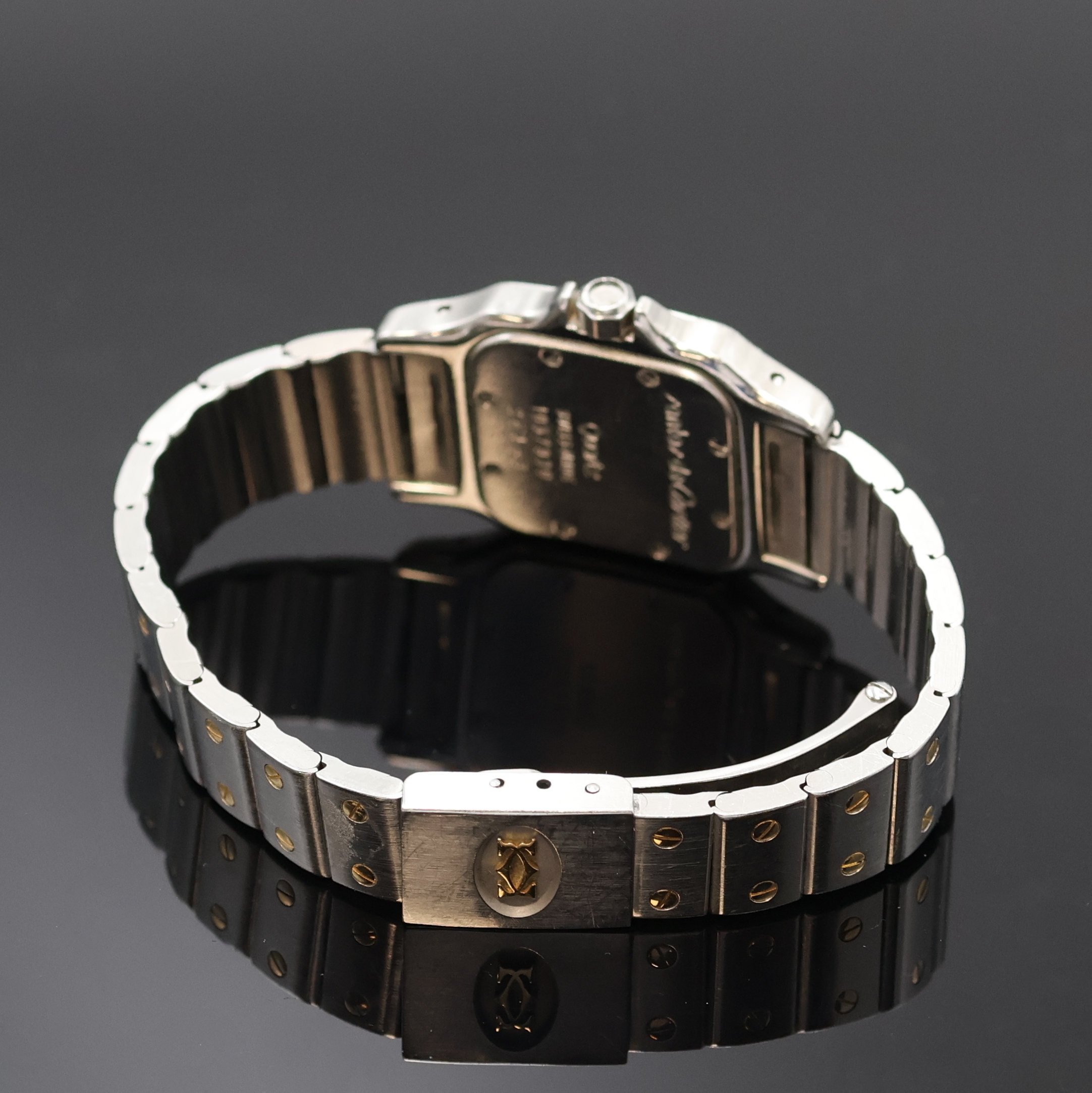 Detail b: CARTIER Santos Armbanduhr in Edelstahl/Gold Referenz 1057930, Schweiz um 1990, quarz, Boden 8-fach verschr., Schmuckkrone (Stein fehlt), orig. ...