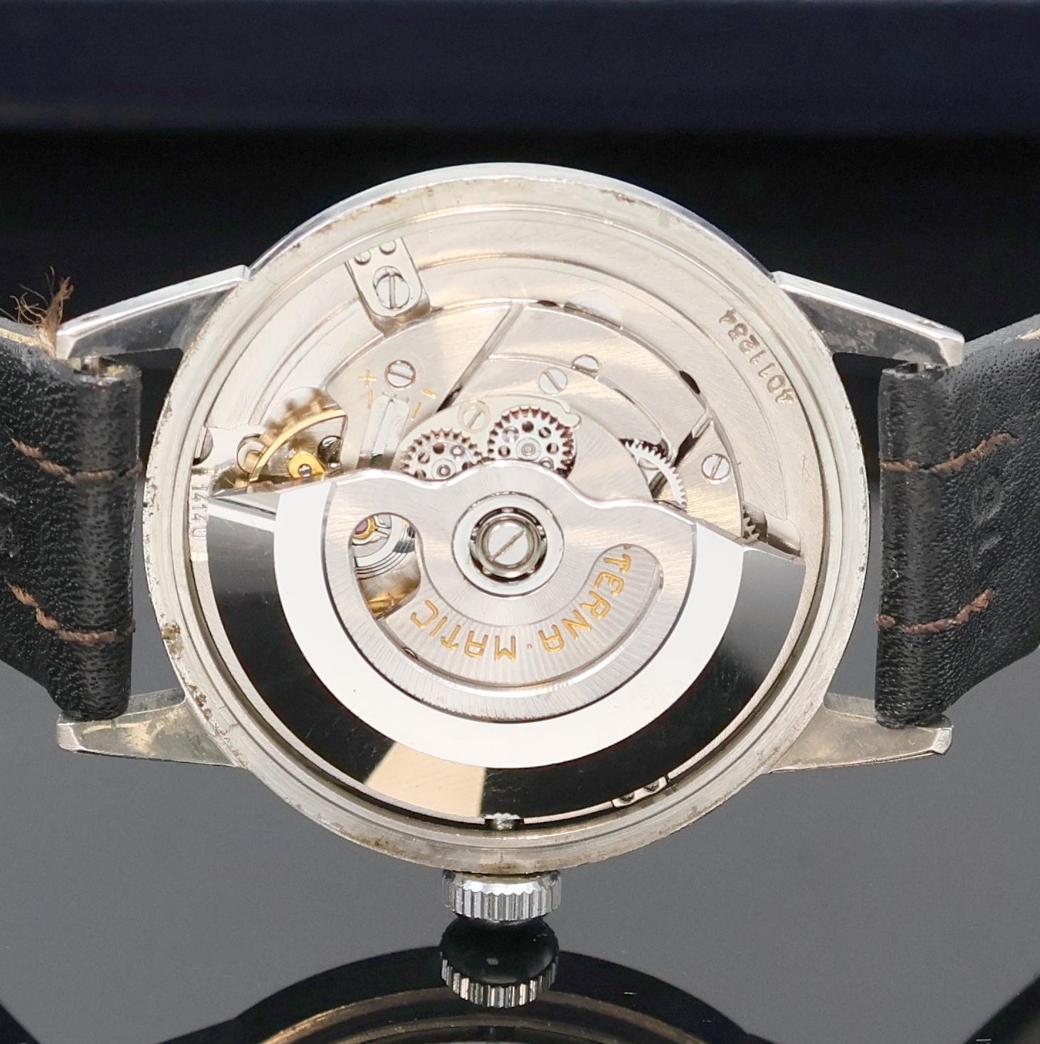 Detail e: ETERNA-MATIC Armbanduhr in Edelstahl, Schweiz um 1990, Automatik, 3-teil. Geh., Boden u. Glasrand aufgedr., silb. Zifferbl. m. gold. Ind. u. silb. ...