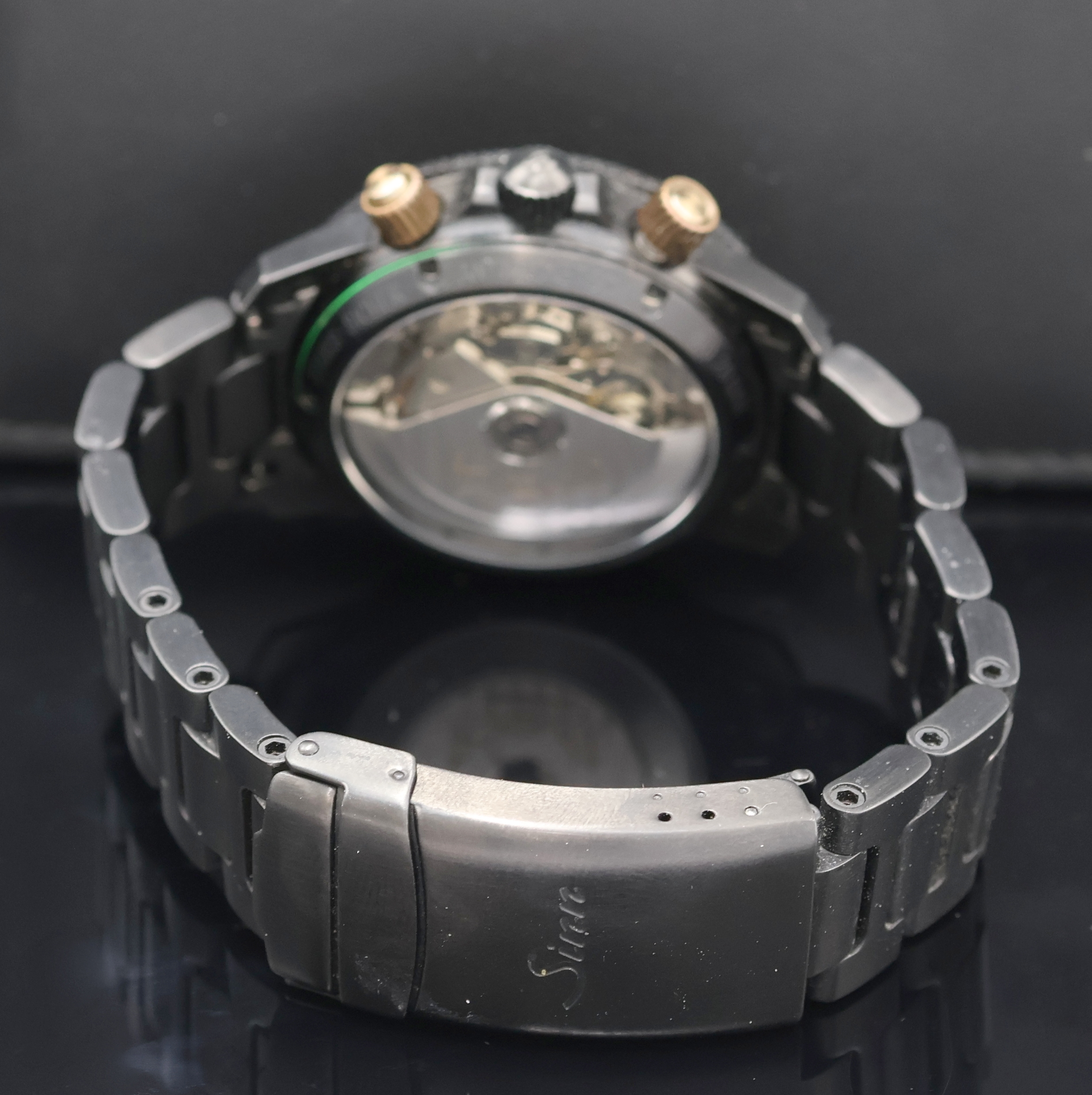 Detail c: SINN Armbandchronograph Referenz 103.28454, Schweiz um 2000, Automatik, geschw. Edelstahlgeh. inkl. Stahlband m. Faltschl., beids. vergl., Boden u. ...
