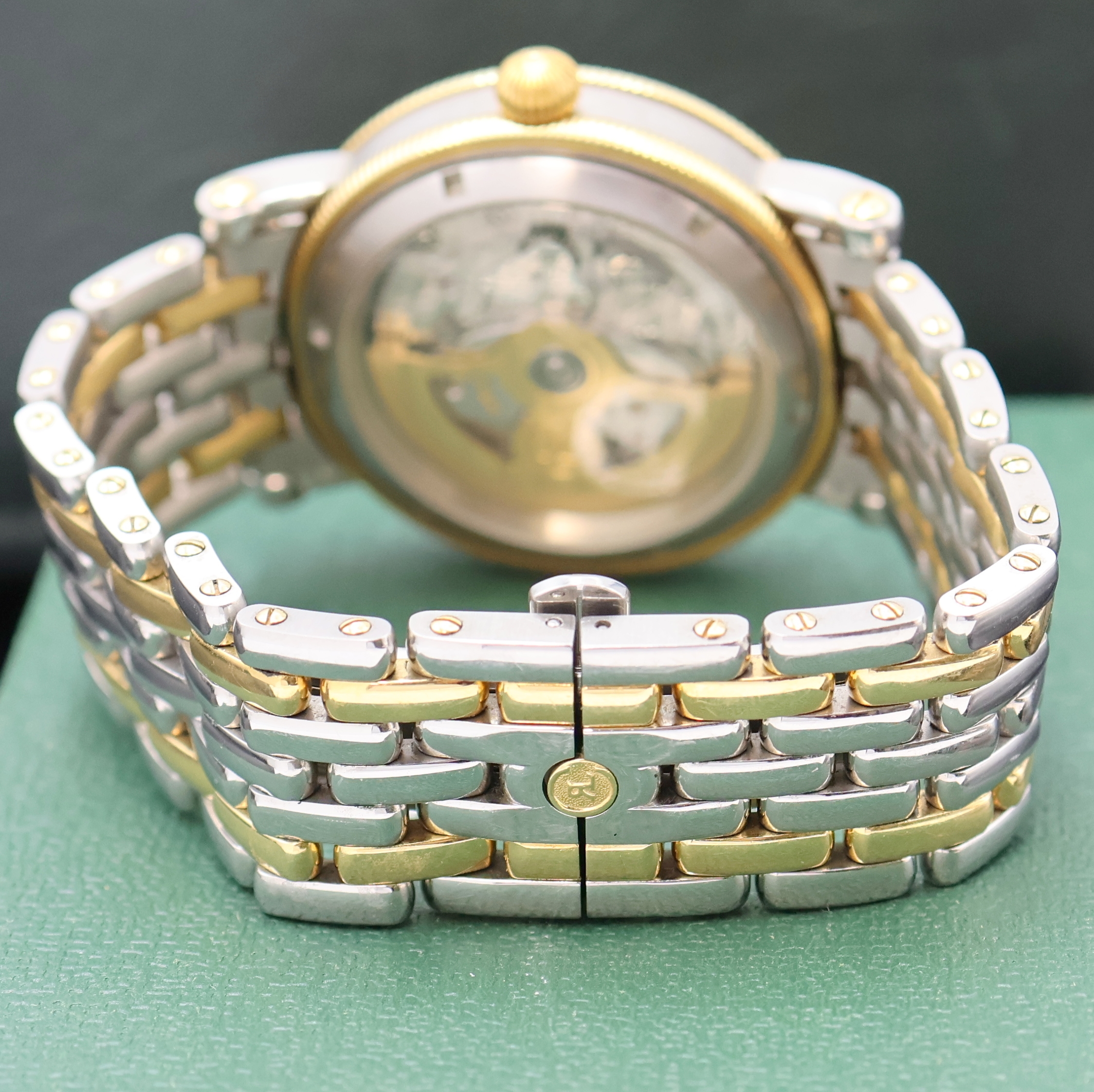 Detail c: CHRONOSWISS Regulateur Herrenarmbanduhr in Stahl/Gold, Schweiz um 2000, Automatik, beids. vergl. Geh., Boden verschr., silb. Zifferbl. m. röm. Std. ...