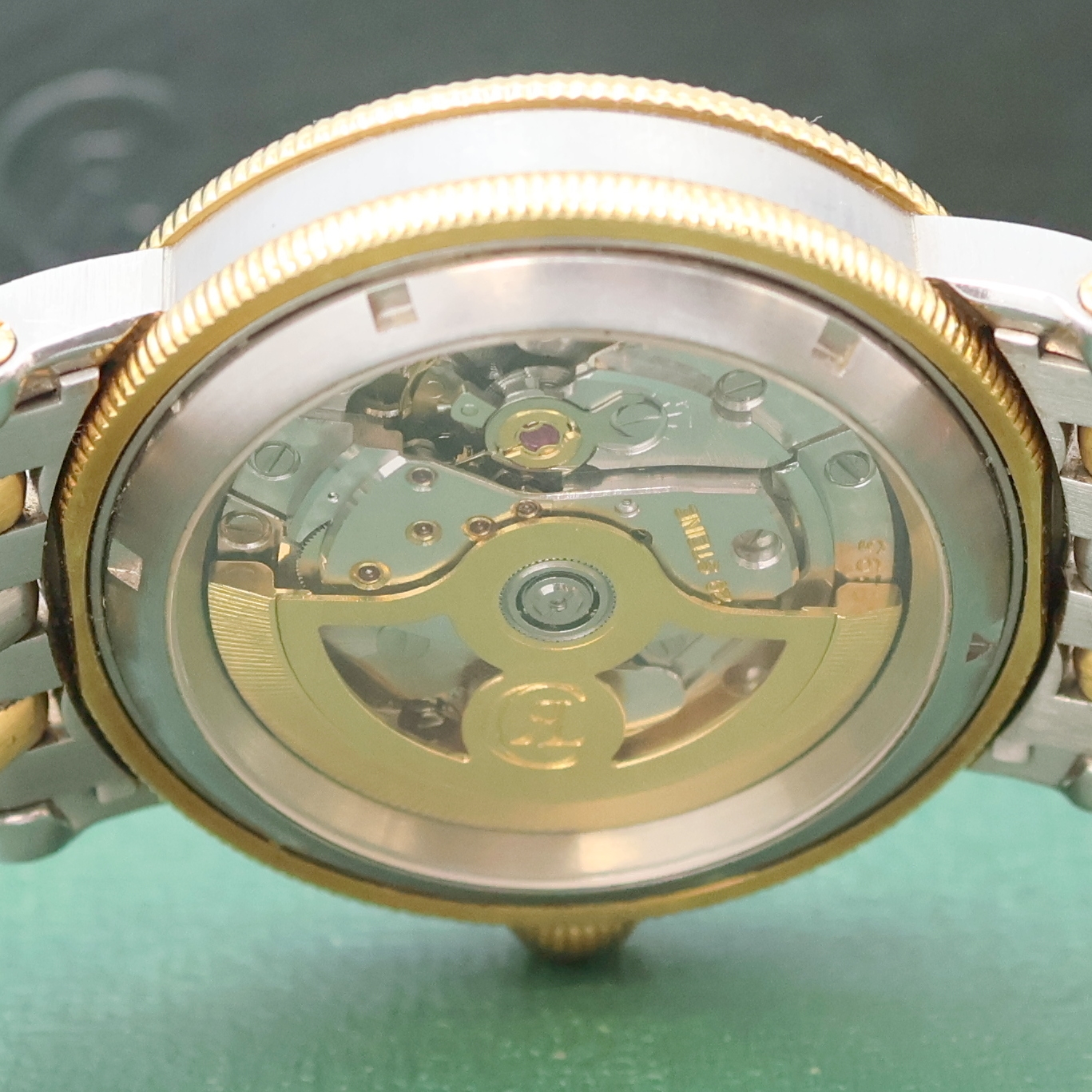 Detail f: CHRONOSWISS Regulateur Herrenarmbanduhr in Stahl/Gold, Schweiz um 2000, Automatik, beids. vergl. Geh., Boden verschr., silb. Zifferbl. m. röm. Std. ...