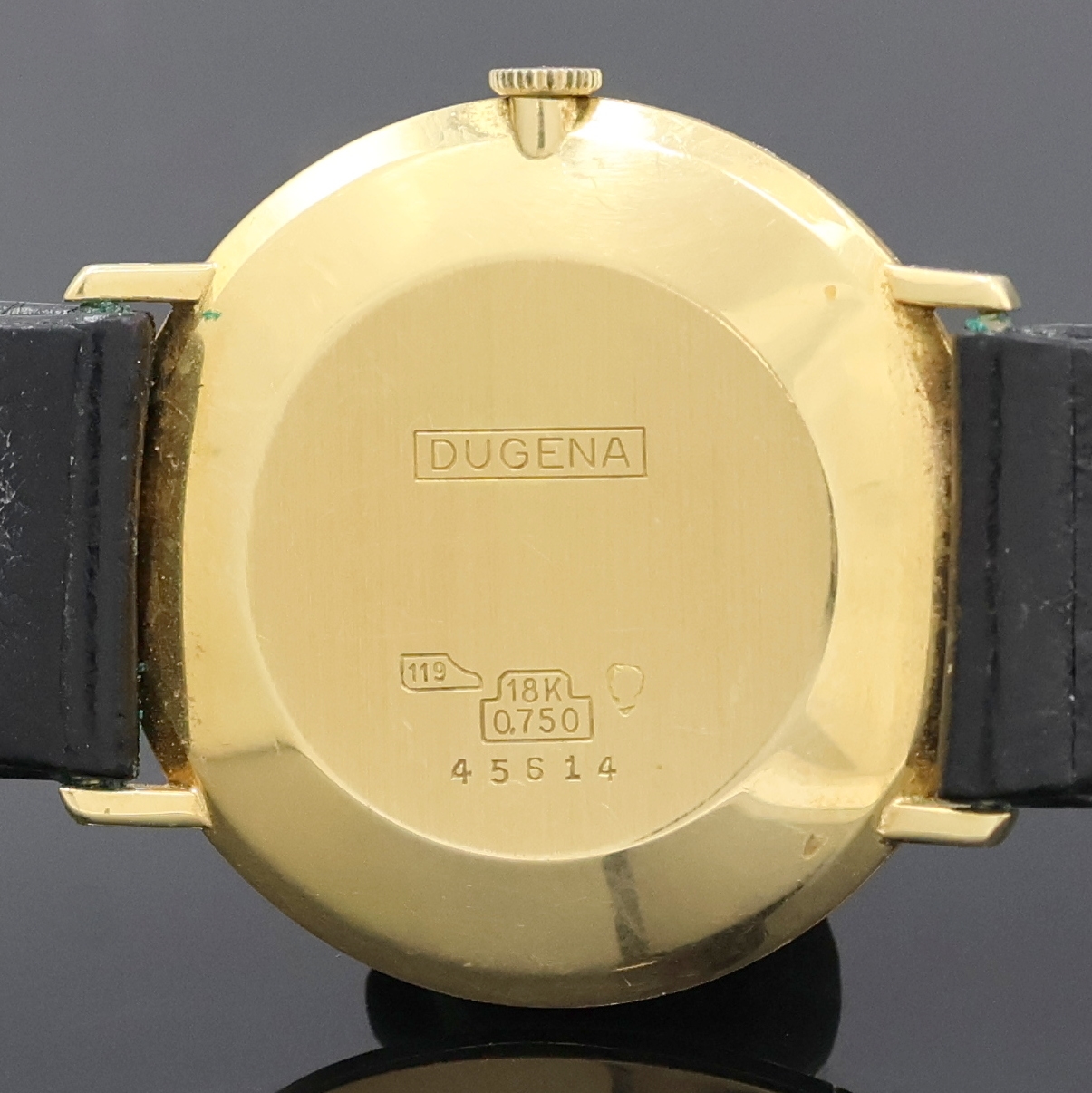 Detail d: DUGENA Festa Herrenarmbanduhr in GG 750/000, Schweiz um 1965, Handaufzug, Glasrand aufgedr., orig. Dugena Lederband m. Dornschl., silb. Zifferbl. m. ...