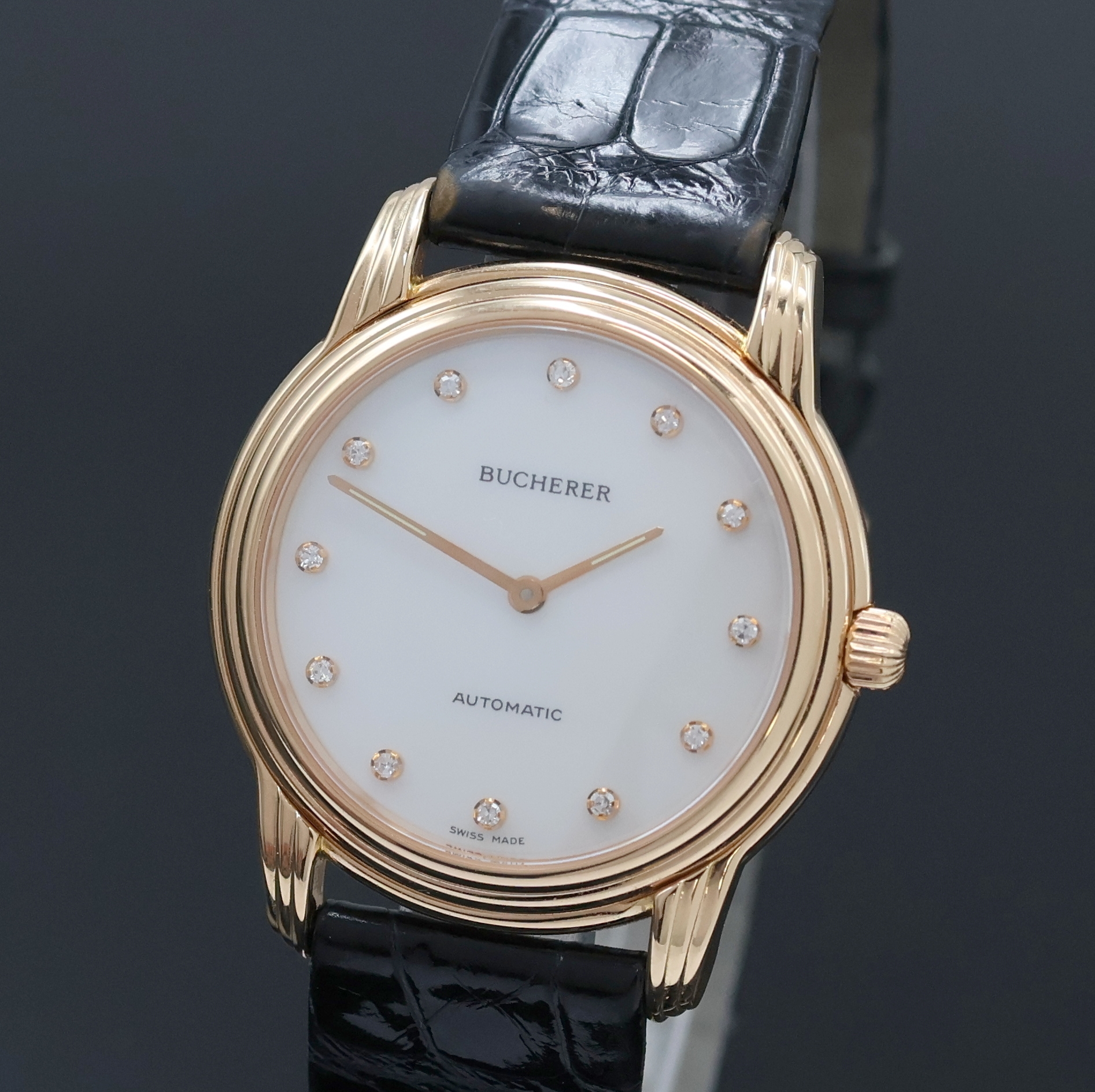 Detail a: BUCHERER elegante Armbanduhr in RG 750/000, Schweiz um 1995, Automatik, beids. vergl. Geh. inkl. orig. Lederband m. orig. RG 750/000 Dornschl., Boden ...