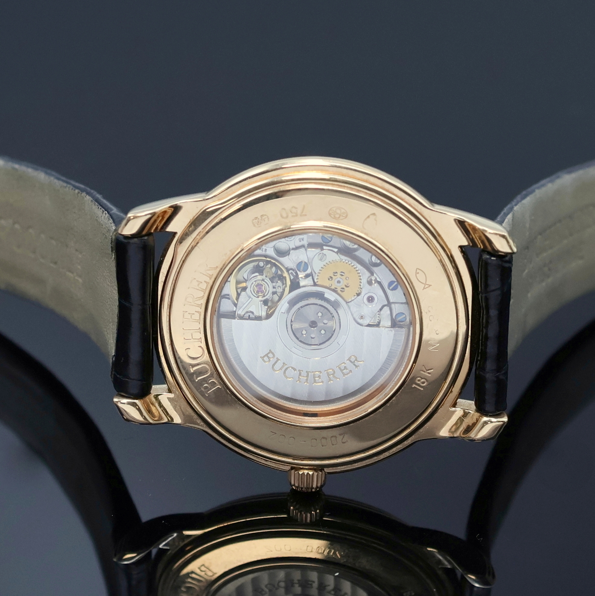 Detail f: BUCHERER elegante Armbanduhr in RG 750/000, Schweiz um 1995, Automatik, beids. vergl. Geh. inkl. orig. Lederband m. orig. RG 750/000 Dornschl., Boden ...