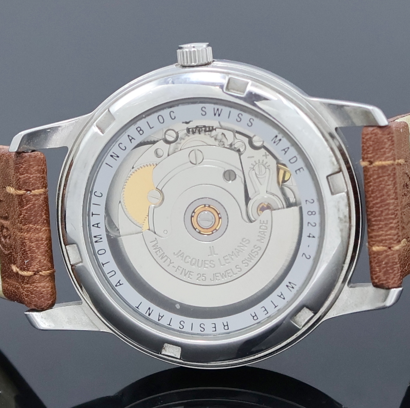 Detail e: JACQUES LEMANS 2 Armbanduhren in Stahl, Schweiz um 2000, Automatik, 1x beids. vergl., Böden verschr. u. aufgedr., 1x orig. Gliederband m. Faltschl., ...
