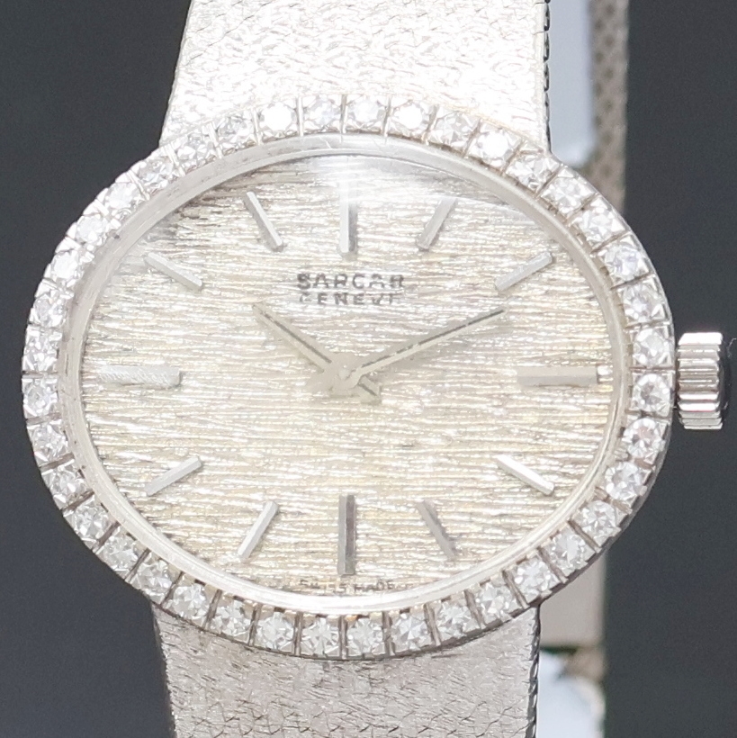 Detail a: SARCAR Damenarmbanduhr in WG 585/000, Schweiz um 1965, Handaufzug, ovales Geh. inkl. SEIKO Goldband m. Klappschl., Boden aufgedr., Lünette m. ...