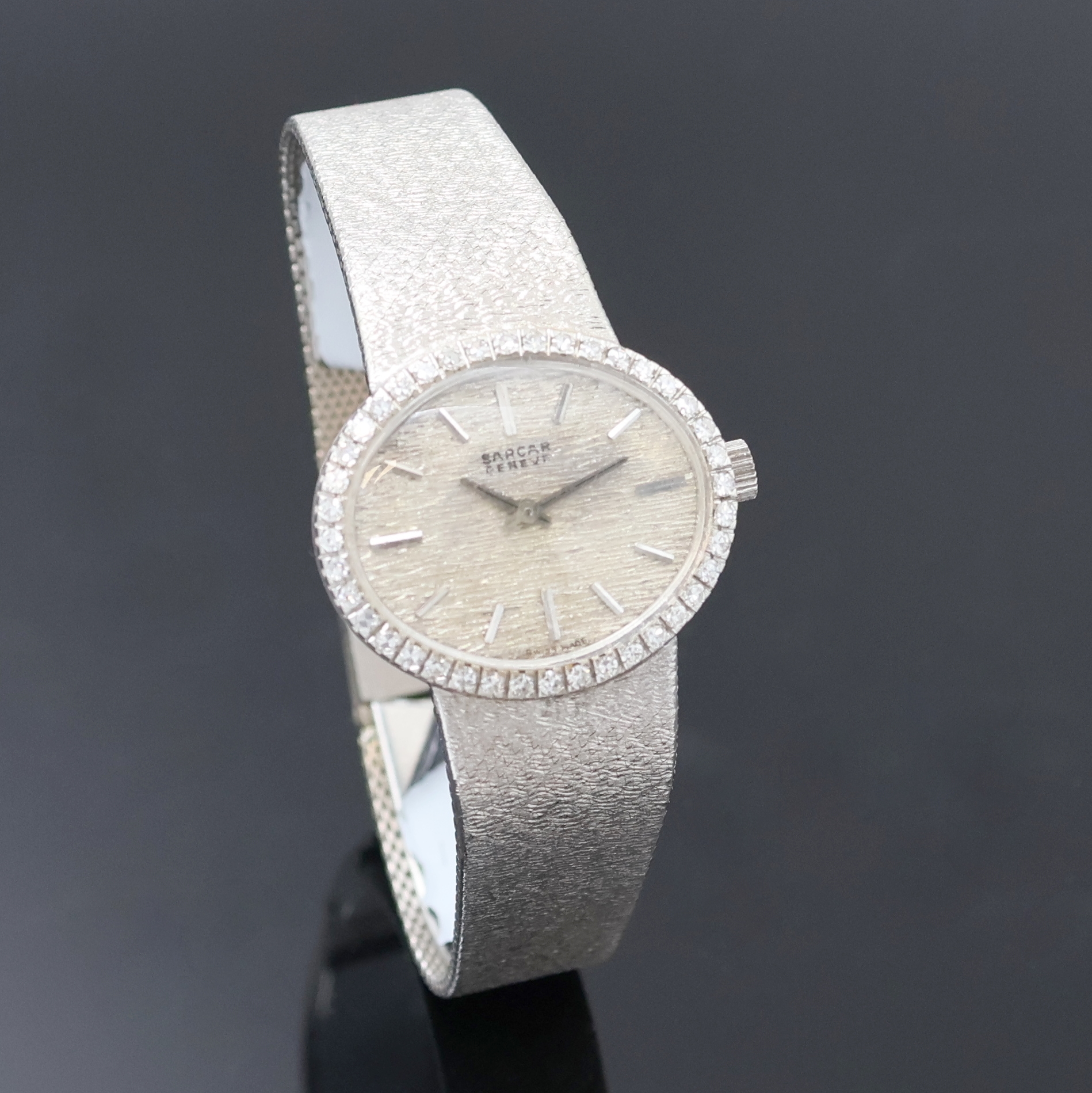 Detail b: SARCAR Damenarmbanduhr in WG 585/000, Schweiz um 1965, Handaufzug, ovales Geh. inkl. SEIKO Goldband m. Klappschl., Boden aufgedr., Lünette m. ...