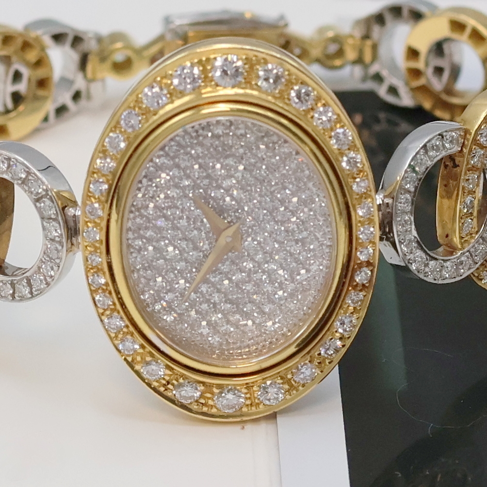 Detail a: Ausgefallene Damenschmuckuhr mit Brillantbesatz in GG 750/000, Schweiz verk. lt. Garantie 01/2000, Handaufzug, Band Design Julia Plana in GG u. WG, ...