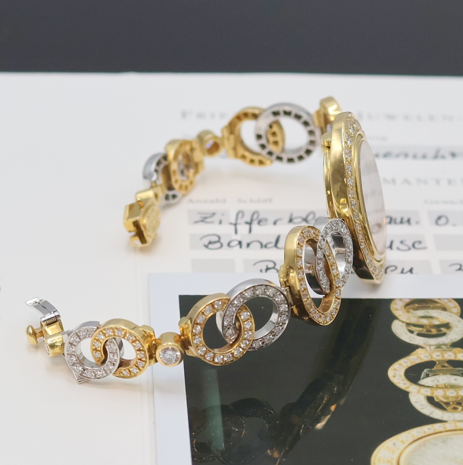 Detail d: Ausgefallene Damenschmuckuhr mit Brillantbesatz in GG 750/000, Schweiz verk. lt. Garantie 01/2000, Handaufzug, Band Design Julia Plana in GG u. WG, ...