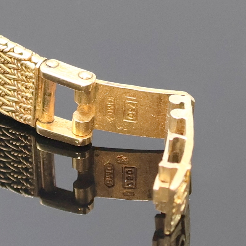 Detail c: BAUME & MERCIER Damenarmbanduhr in GG 750/000, Schweiz um 1970, quarz, Boden aufgedr., orig. Goldband, Schmuckkrone, gold. Zifferbl. m. gold. ...