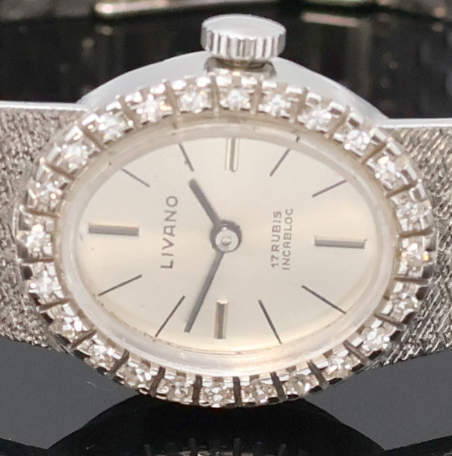 Detail a: LIVANO Damenarmbanduhr in WG 585/000 mit Diamanten, Schweiz um 1965, Handaufzug, Goldband, Boden aufgedr., Lünette aufw. m. Diamanten bes., silb. ...