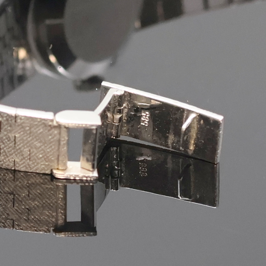 Detail b: LIVANO Damenarmbanduhr in WG 585/000 mit Diamanten, Schweiz um 1965, Handaufzug, Goldband, Boden aufgedr., Lünette aufw. m. Diamanten bes., silb. ...