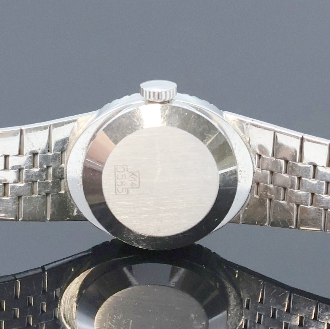 Detail d: LIVANO Damenarmbanduhr in WG 585/000 mit Diamanten, Schweiz um 1965, Handaufzug, Goldband, Boden aufgedr., Lünette aufw. m. Diamanten bes., silb. ...