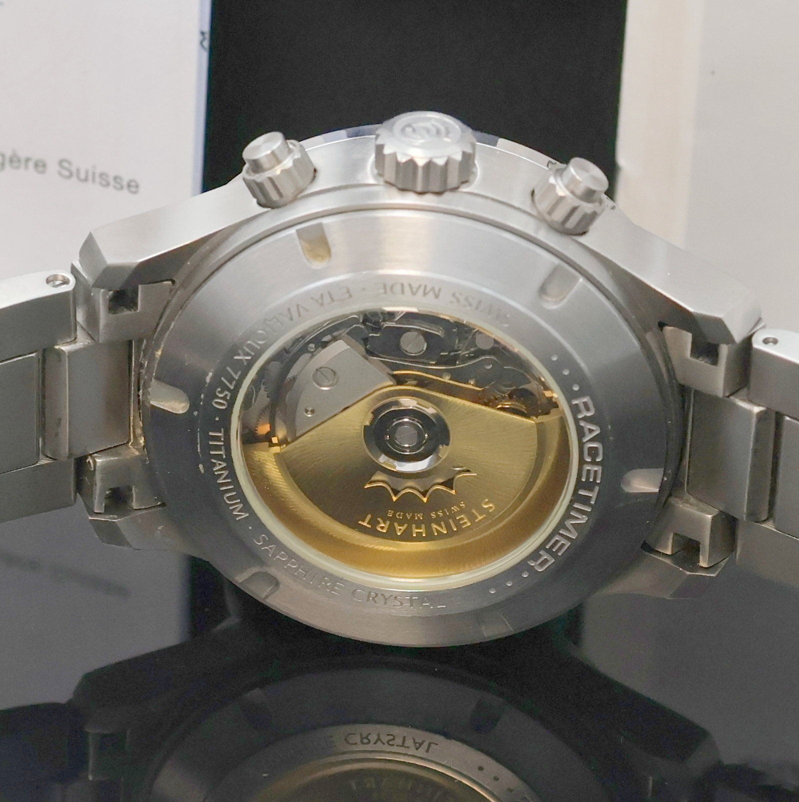 Detail d: STEINHART Racetimer Armbandchronograph in Titan, Schweiz verk. lt. beil. Pap. 04/2014, Automatik, beids. vergl. Geh., Boden, Krone u. Drücker ...
