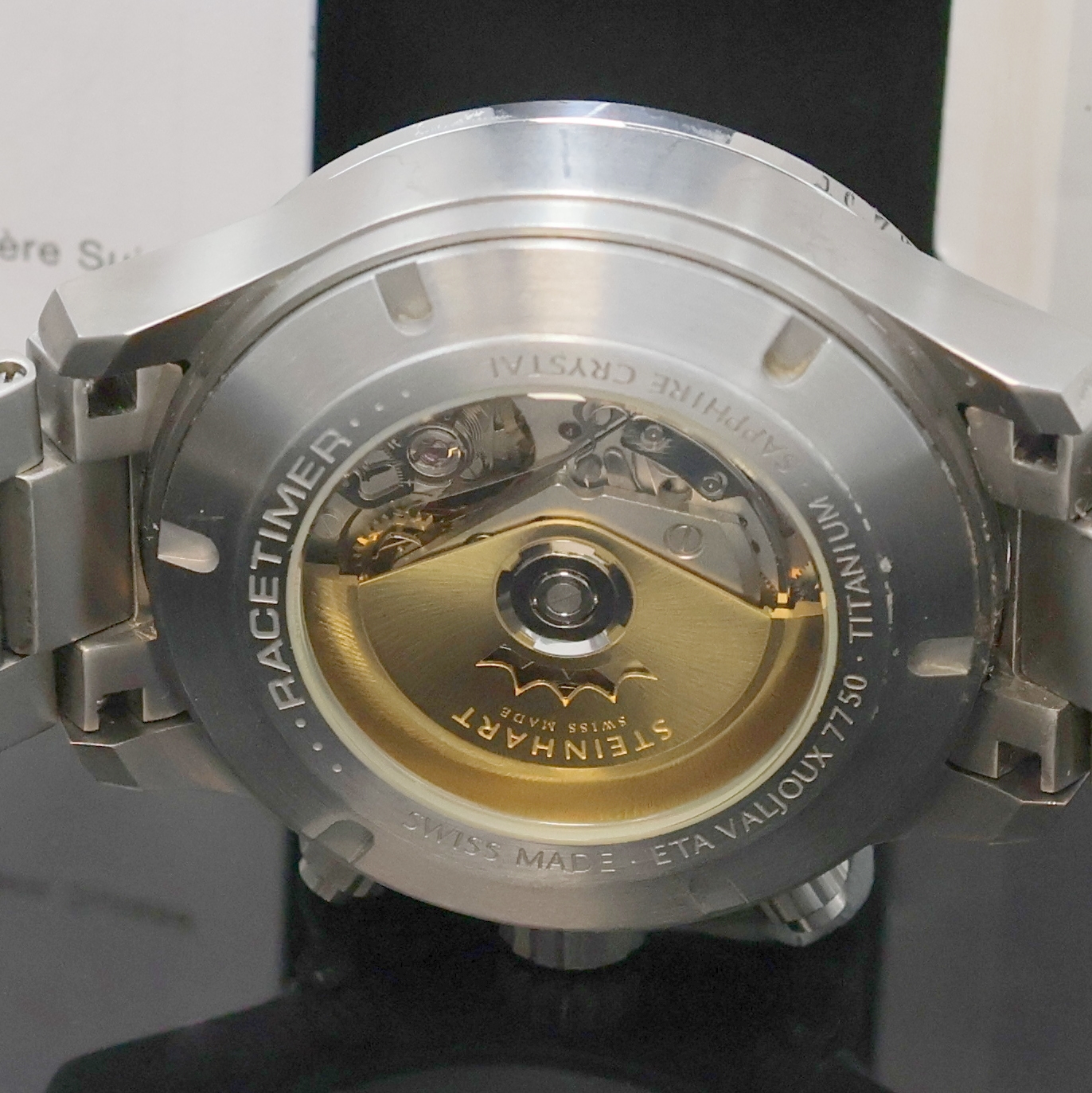 Detail e: STEINHART Racetimer Armbandchronograph in Titan, Schweiz verk. lt. beil. Pap. 04/2014, Automatik, beids. vergl. Geh., Boden, Krone u. Drücker ...