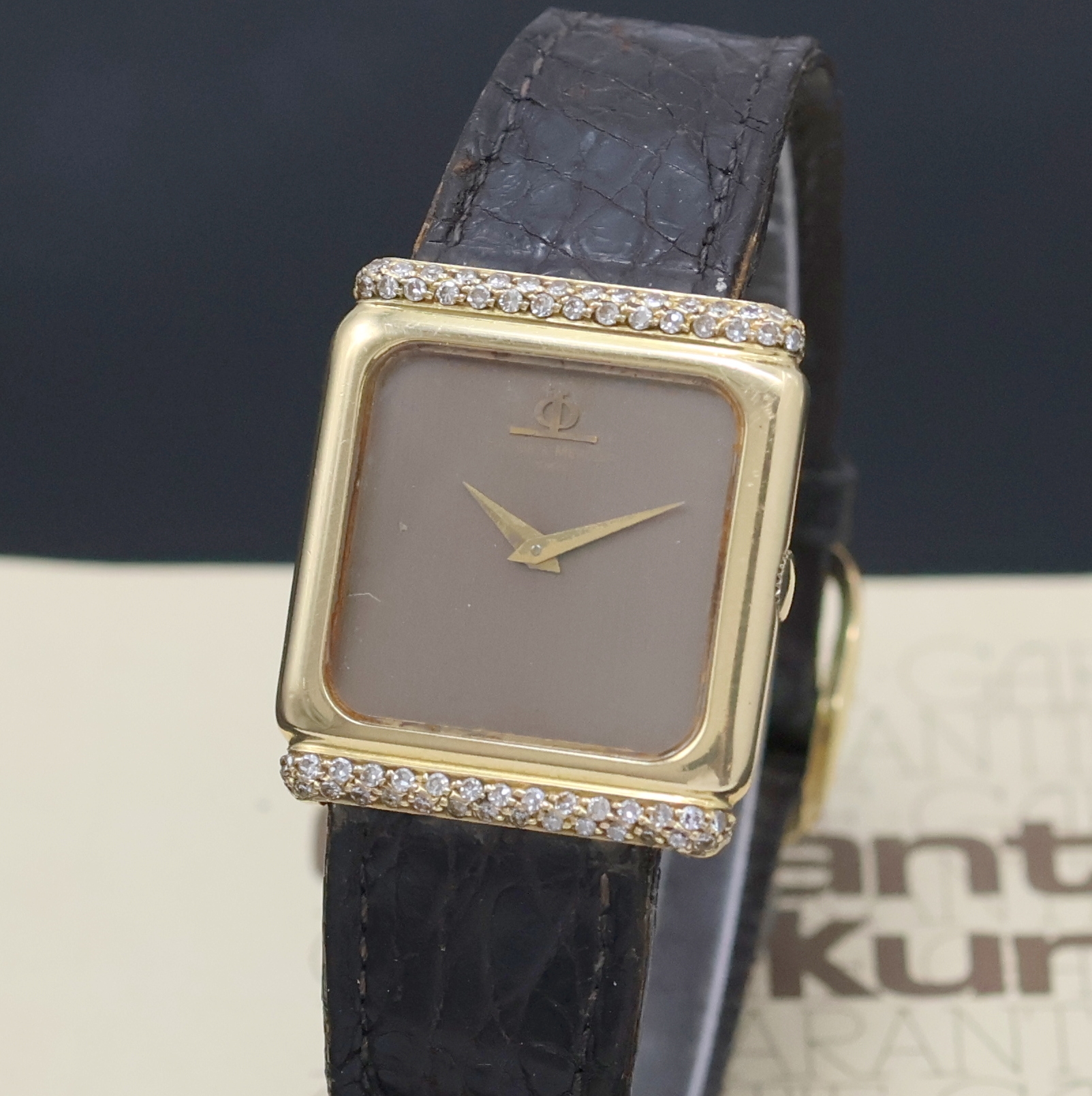 Detail a: BAUME & MERCIER Armbanduhr in GG 750/000 m. Diamanten, Schweiz verk. lt. beil. Garantie 02/1988, Handaufzug, Boden aufgedr., Lederband m. orig. verg. ...