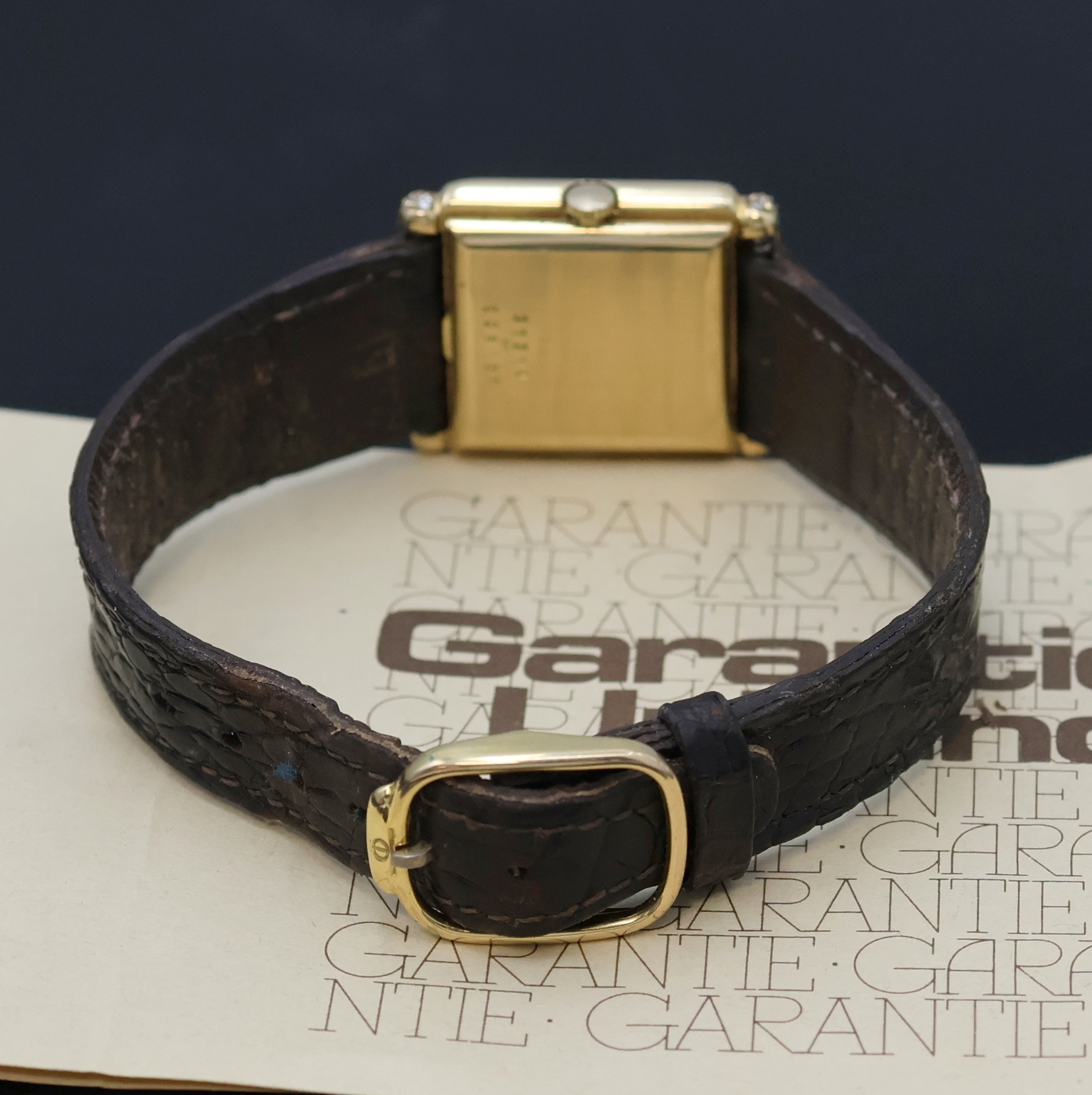Detail c: BAUME & MERCIER Armbanduhr in GG 750/000 m. Diamanten, Schweiz verk. lt. beil. Garantie 02/1988, Handaufzug, Boden aufgedr., Lederband m. orig. verg. ...