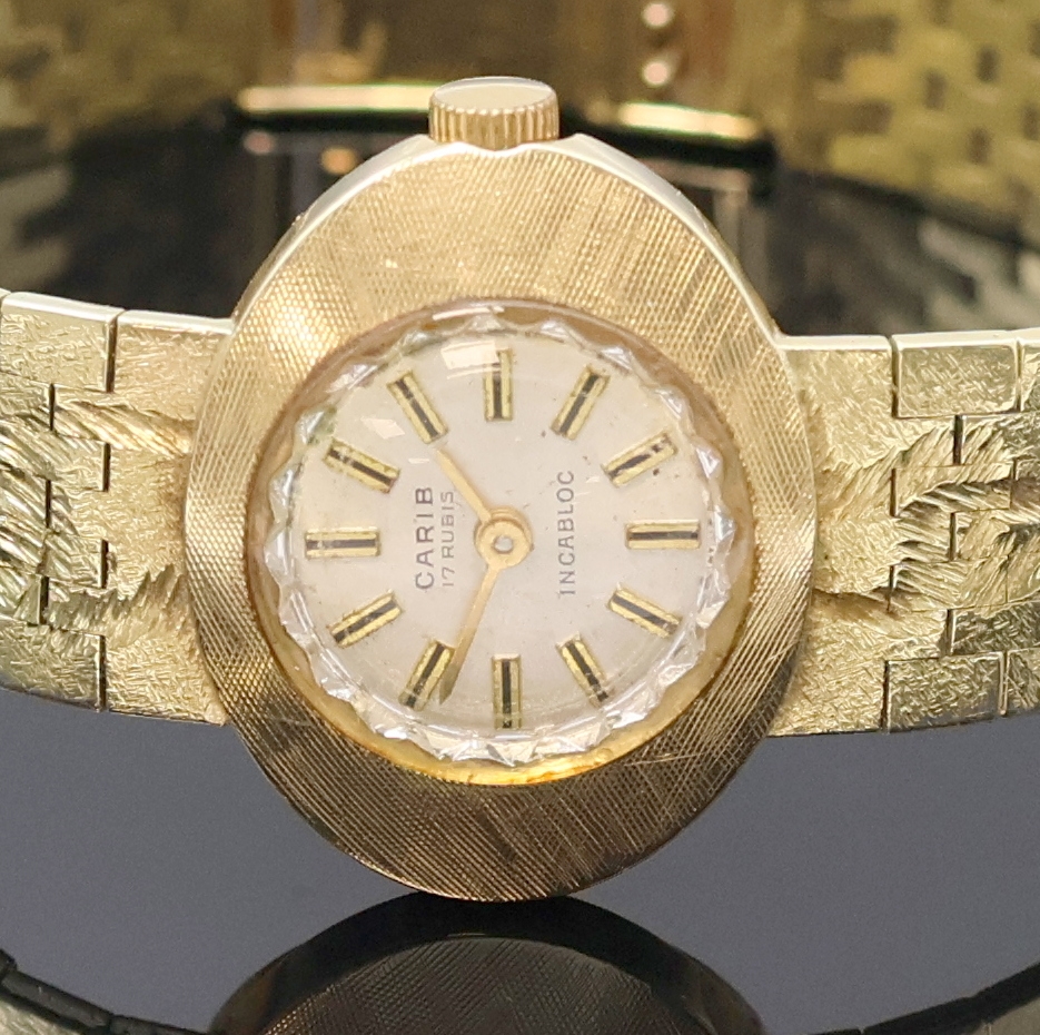Detail a: CARIB Damenarmbanduhr in GG 585/000, Schweiz um 1965, Handaufzug, Goldband, Boden aufgedr., silb. Zifferbl. m. aufges. Std.- Ind., gold. Zeiger, Kal. ...