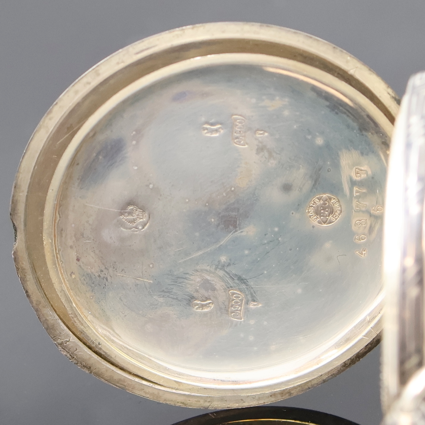 Detail e: IWC Herrentaschenuhr in Tula-Silber, Schweiz um 1909, offenes Geh. mit Tula-Einlage teilw. fehlend, Emailzifferbl. mit arab. Zahlen riss., gebl. ...