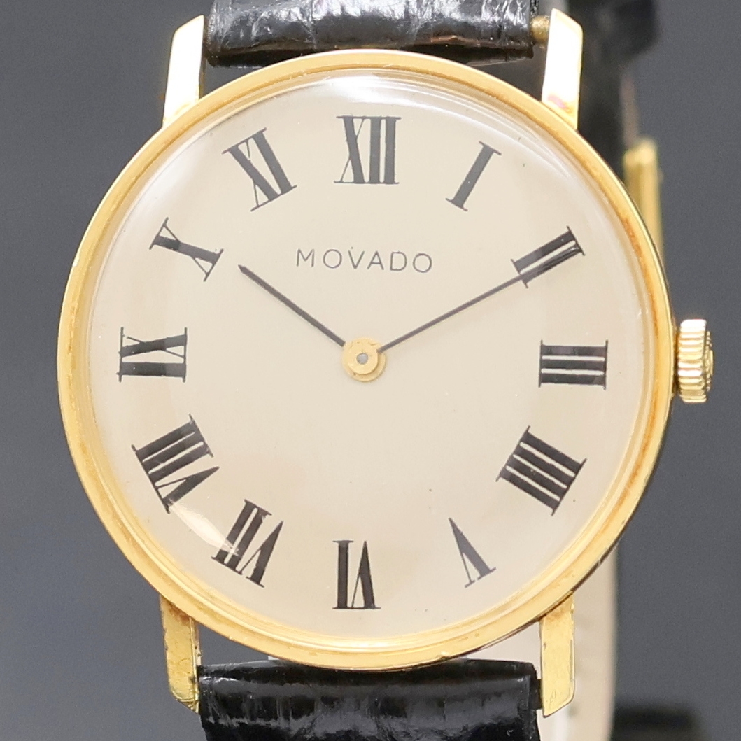 Detail a: MOVADO Armbanduhr in GG 750/000, Handaufzug, Schweiz um 1968, Boden und Glasrand aufgedr.,flache Gesamtausführ., silb. Zifferbl. m. röm. Std., ...