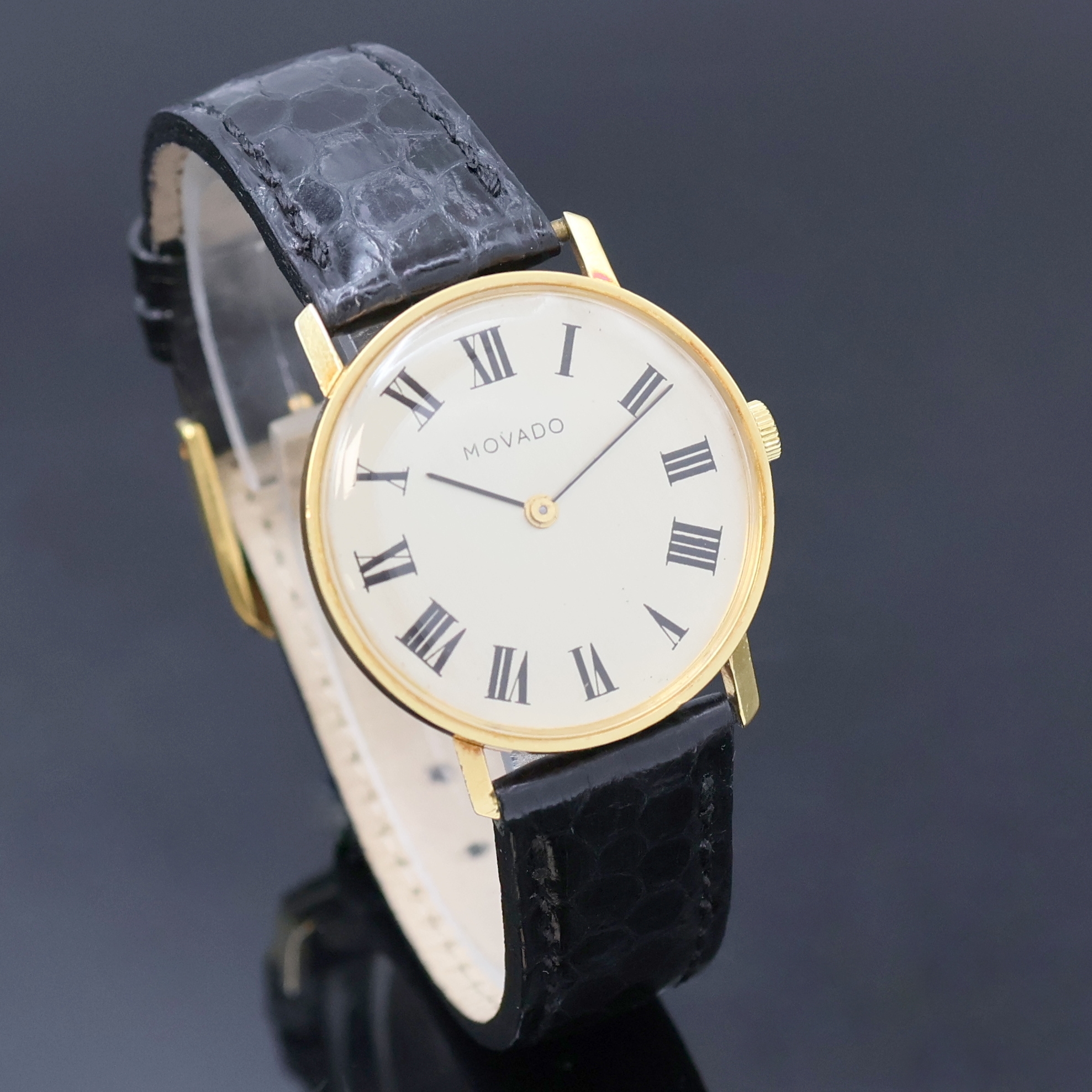 Detail b: MOVADO Armbanduhr in GG 750/000, Handaufzug, Schweiz um 1968, Boden und Glasrand aufgedr.,flache Gesamtausführ., silb. Zifferbl. m. röm. Std., ...