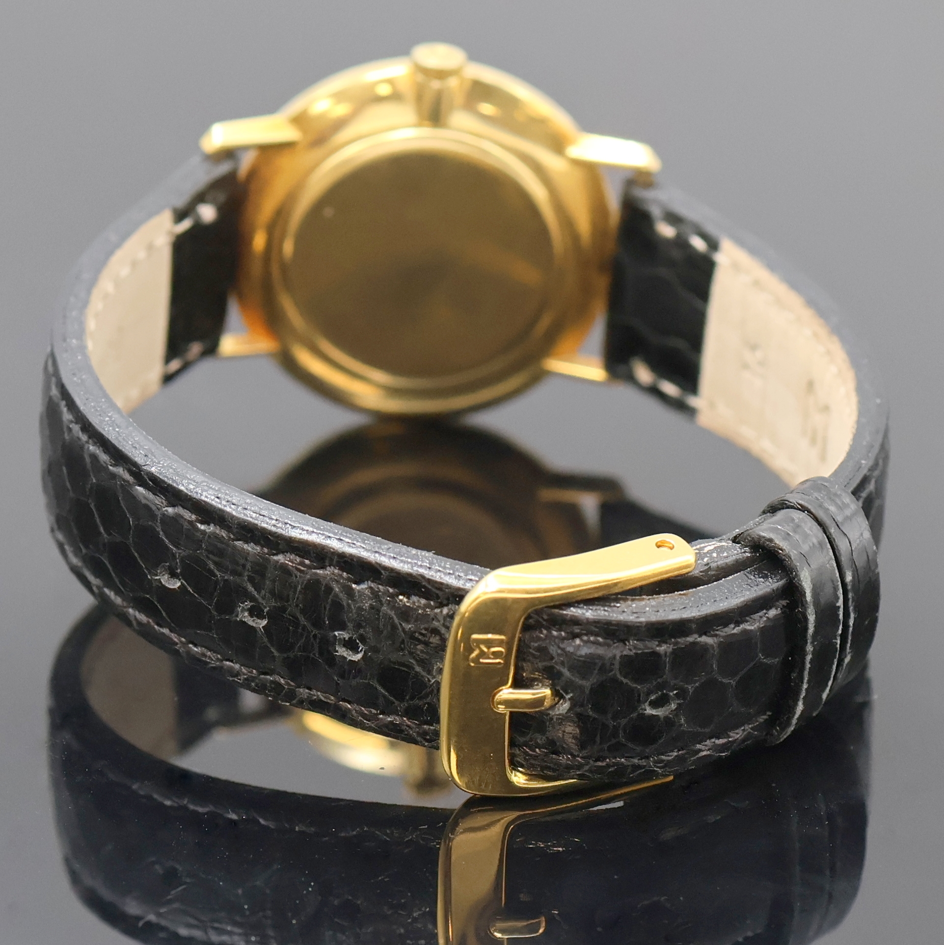 Detail c: MOVADO Armbanduhr in GG 750/000, Handaufzug, Schweiz um 1968, Boden und Glasrand aufgedr.,flache Gesamtausführ., silb. Zifferbl. m. röm. Std., ...