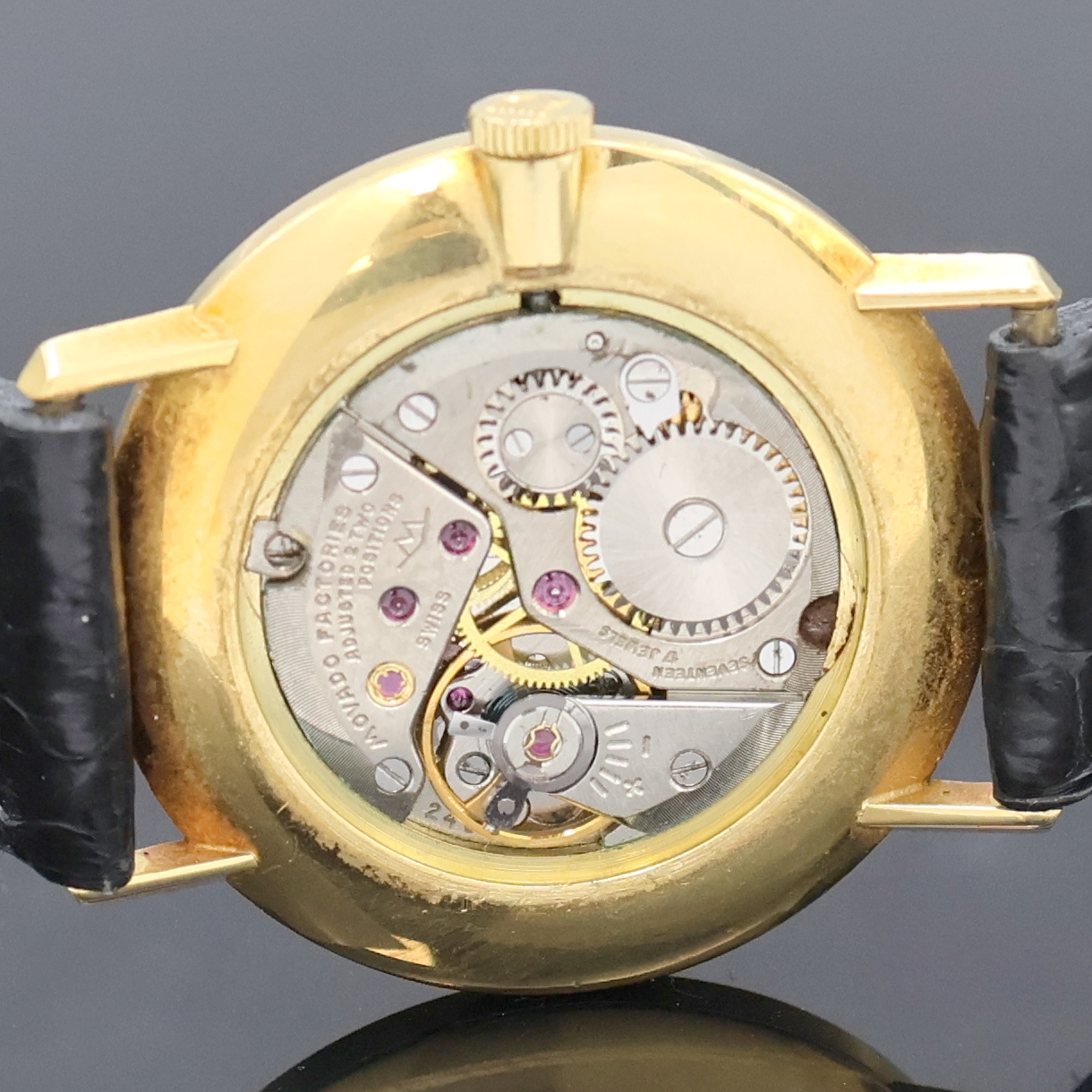 Detail f: MOVADO Armbanduhr in GG 750/000, Handaufzug, Schweiz um 1968, Boden und Glasrand aufgedr.,flache Gesamtausführ., silb. Zifferbl. m. röm. Std., ...