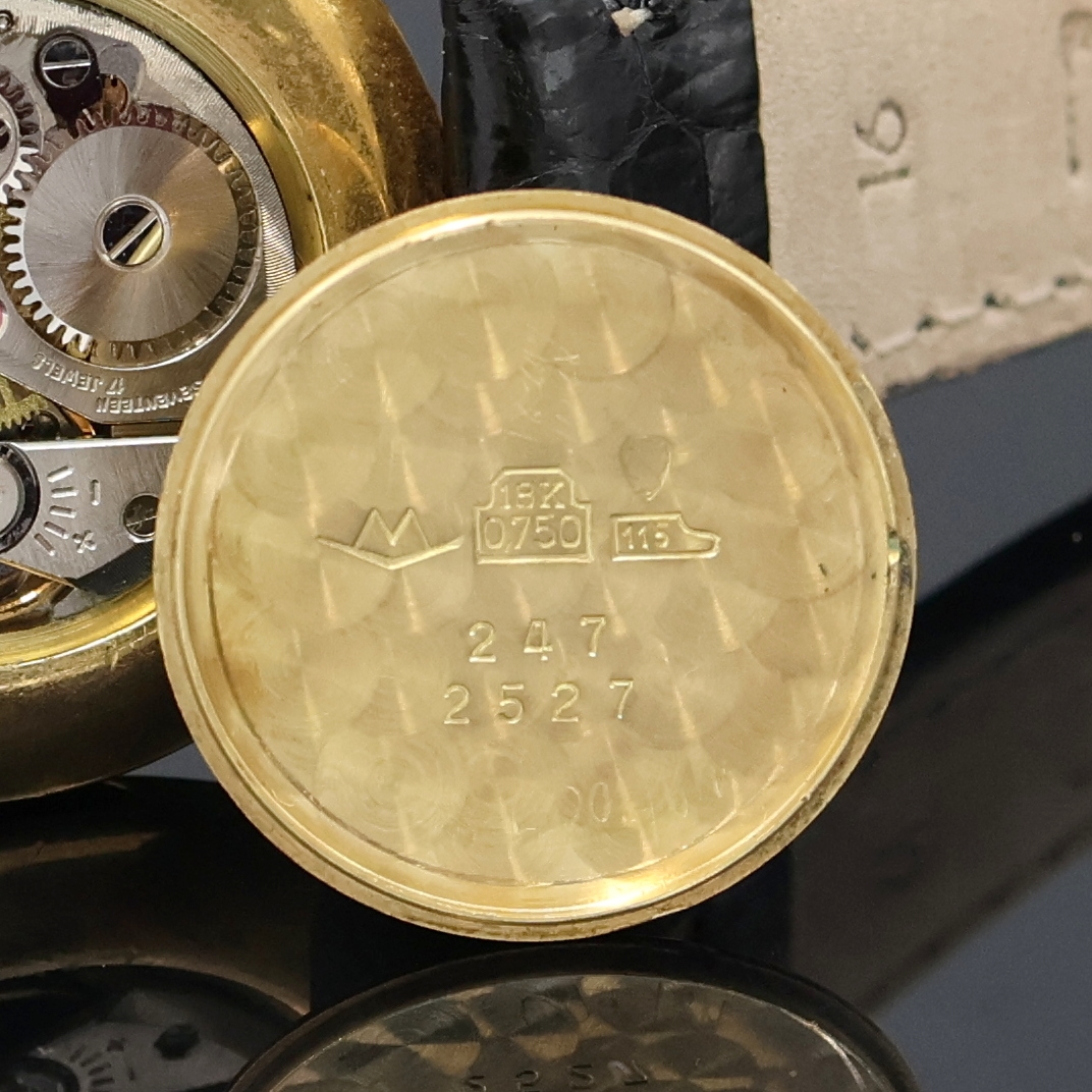 Detail g: MOVADO Armbanduhr in GG 750/000, Handaufzug, Schweiz um 1968, Boden und Glasrand aufgedr.,flache Gesamtausführ., silb. Zifferbl. m. röm. Std., ...