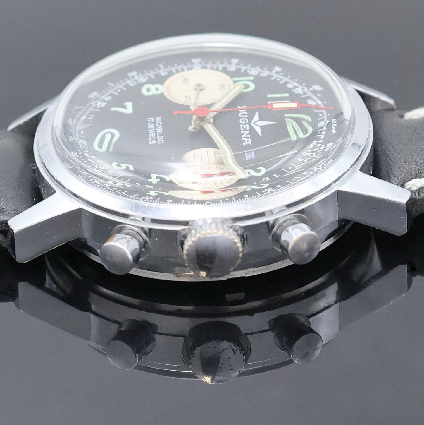 Detail c: DUGENA Herrenarmbanduhr mit Chronograph, Handaufzug, Schweiz um 1970, verchr. Geh. m. verschr. Stahlboden, schwarzes Zifferbl. m. arab. Std., silb. ...