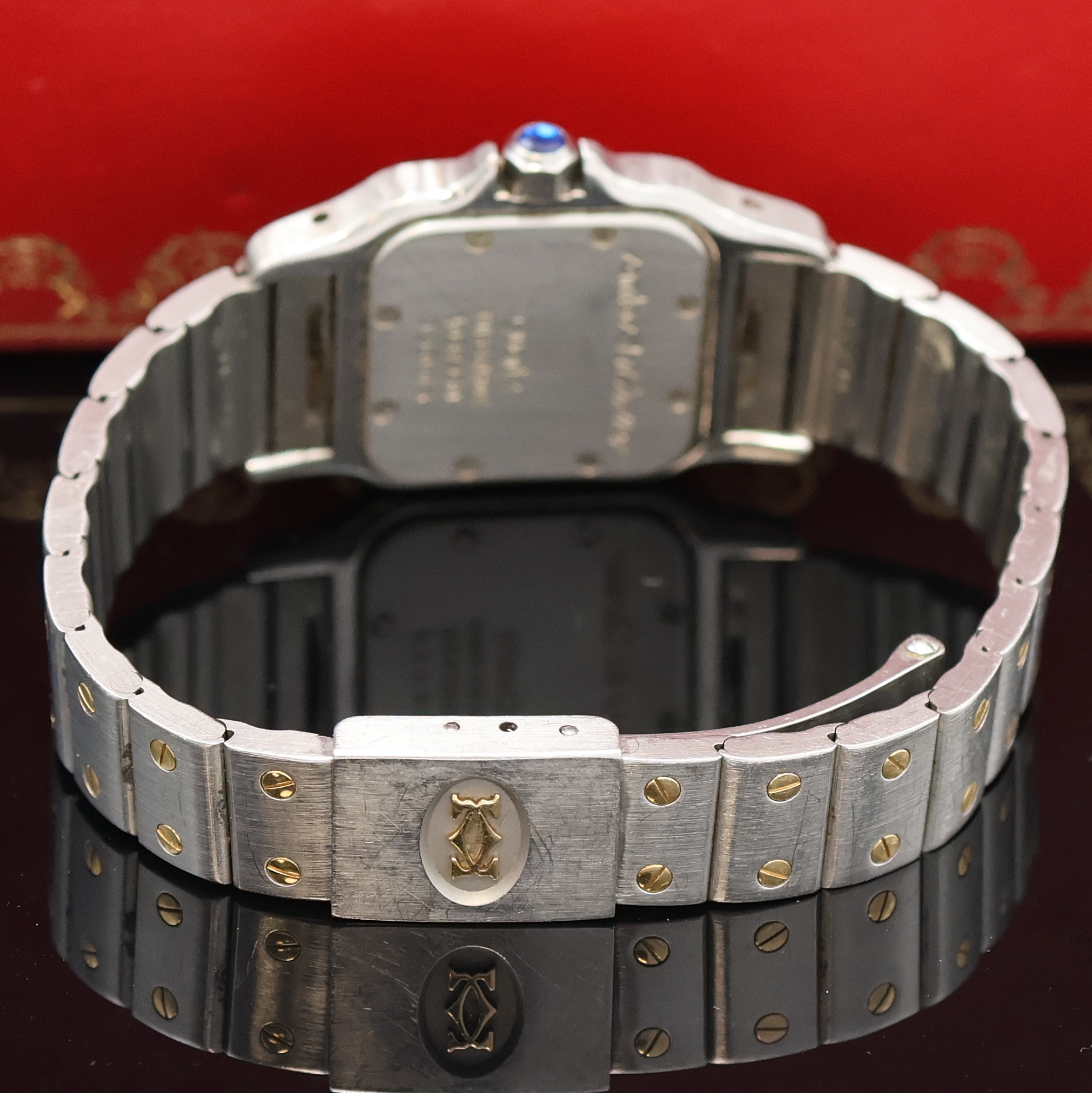 Detail c: CARTIER Santos Damenarmbanduhr in Stahl/Gold Referenz 1057930, Schweiz um 1995, quarz, Boden 8-fach verschr., orig. Gliederband m. Faltschl., silb. ...