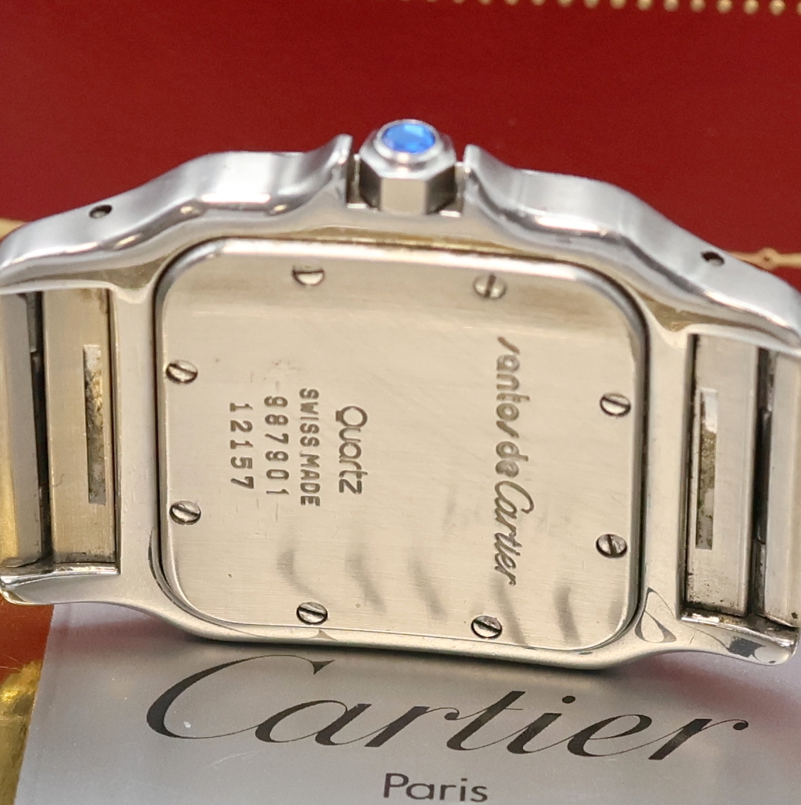 Detail e: CARTIER Santos Armbanduhr in Stahl Referenz 987901, Schweiz um 1990, quarz, Boden 8- fach verschr., orig. Gliederband (1x Schr. def./zu ers.) m. ...