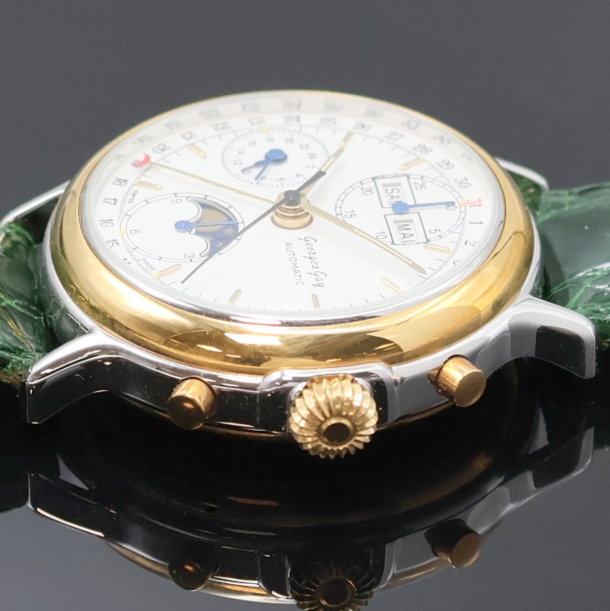 Detail b: GEORGES GAY Armbandchronograph mit Vollkalender in Stahl/Gold, Schweiz um 1995, Automatik, beids. vergl. Geh., aufgedr. Boden u. Lünette verg., ...