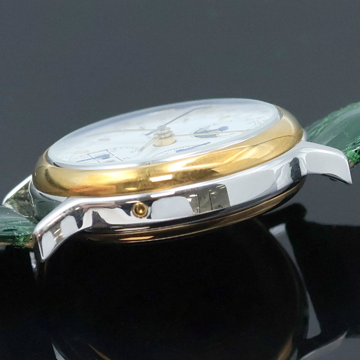 Detail c: GEORGES GAY Armbandchronograph mit Vollkalender in Stahl/Gold, Schweiz um 1995, Automatik, beids. vergl. Geh., aufgedr. Boden u. Lünette verg., ...