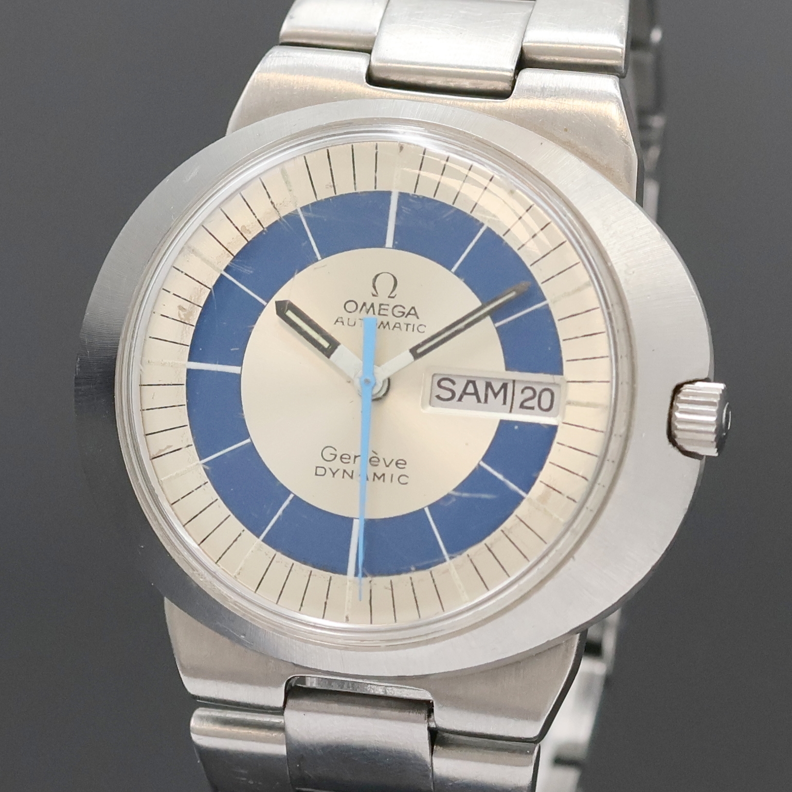 Detail a: OMEGA Geneve Dynamic Herrenarmbanduhr in Edelstahl, Schweiz um 1970, Automatik, Monocoque-Geh. inkl. Gliederband m. Faltschl., 2-farb. Zifferbl., ...