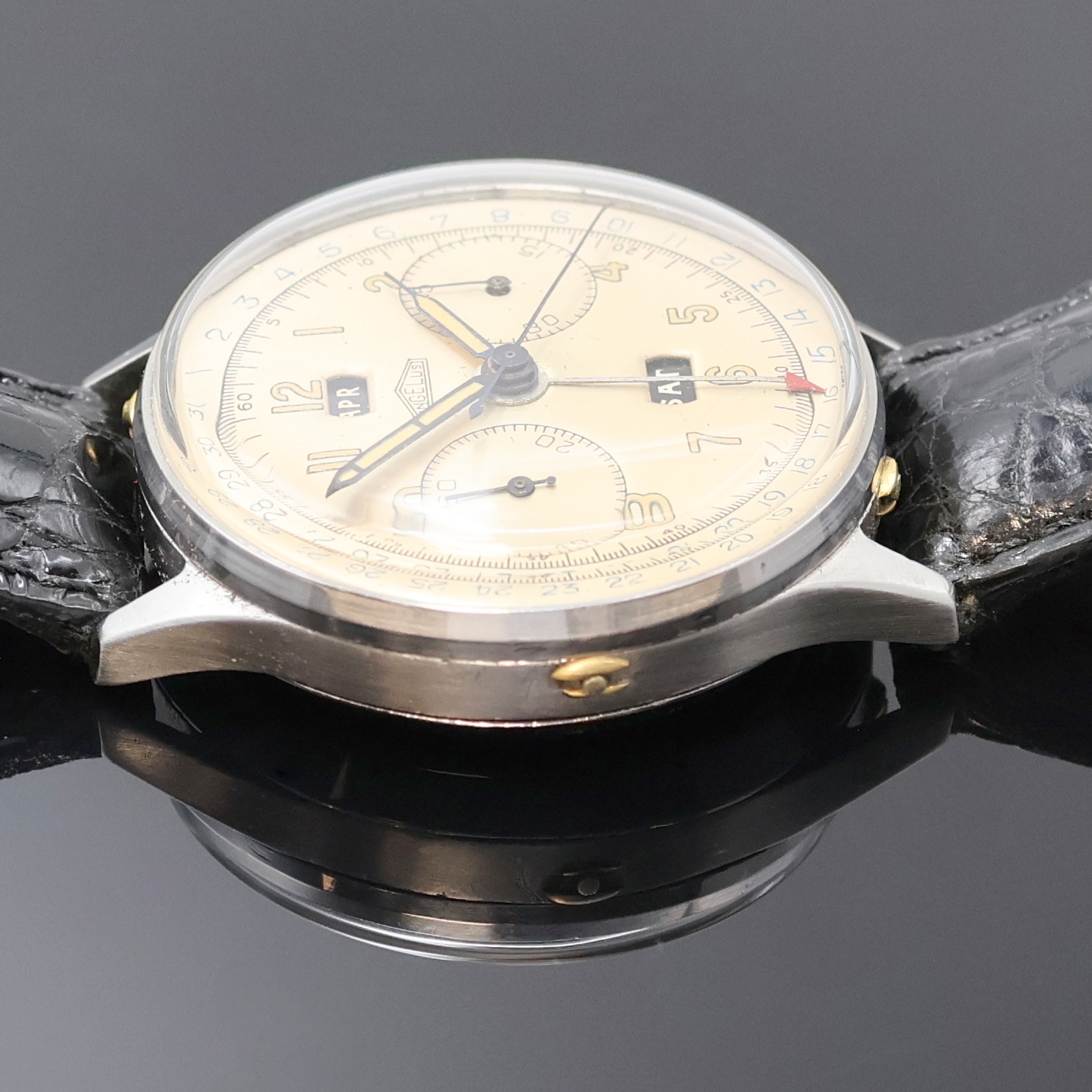 Detail c: ANGELUS Schaltradchronograph Chronodato, Schweiz 1940er Jahre, Handaufzug, unsign. Edelstahlgeh., Boden und Glasrand aufgedr., vers. Zifferblatt ...
