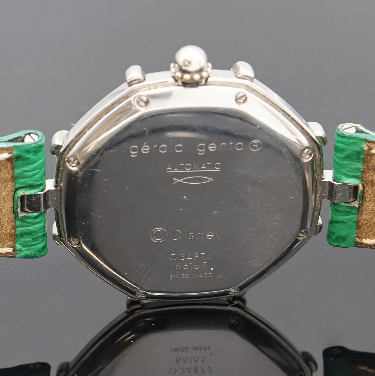 Detail d: GERALD GENTA Disney Armbanduhr Referenz G.3487.7, Schweiz 1990er Jahre, Automatik, Edelstahlgeh. inkl. neutr. Lederband m. Faltschl., Boden 8-fach ...