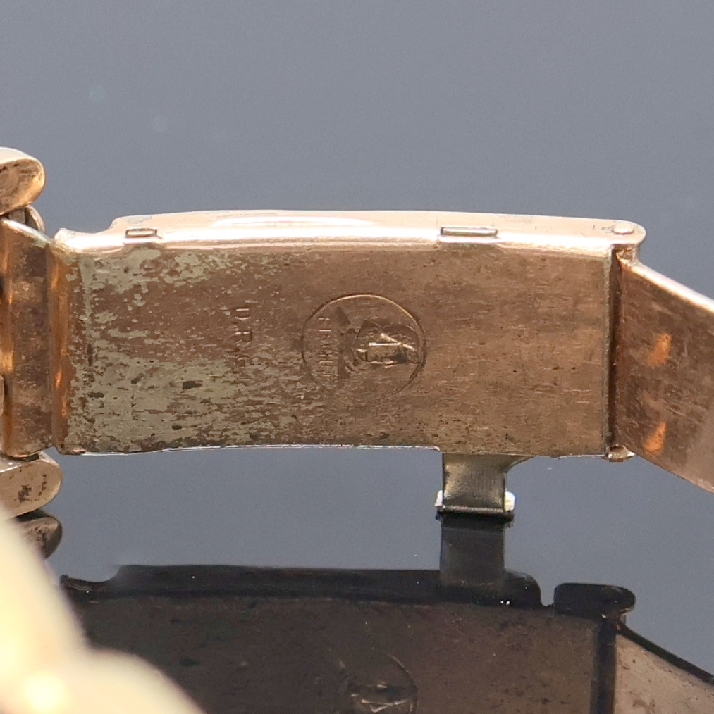 Detail d: HANHART rot-vergoldete Herrenarmbanduhr, Deutschland um 1940, Handaufzug, 2-tlg. Geh., Stahlboden aufgedr., zeitident. rotverg. Gliederband, silb. ...