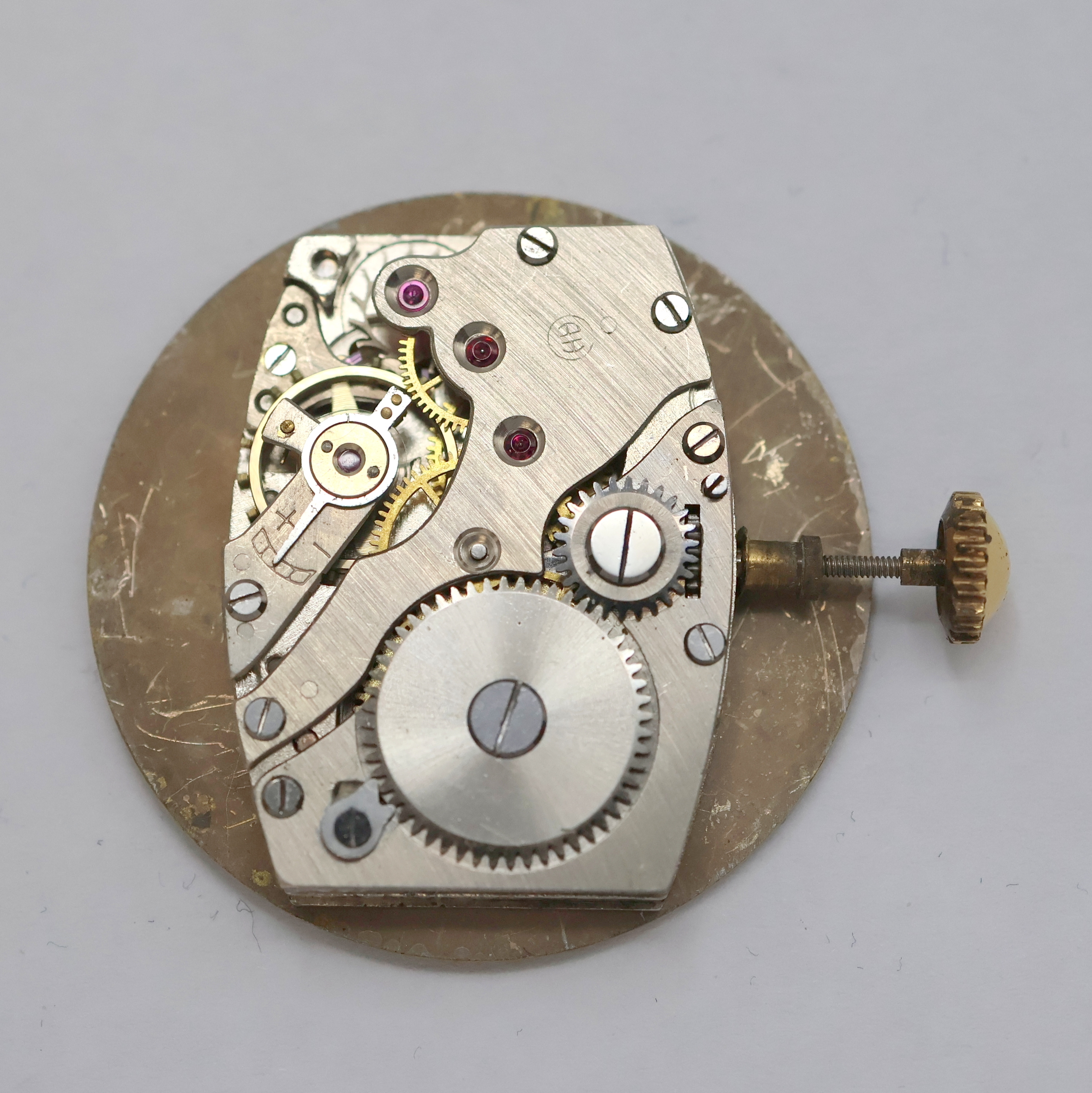 Detail g: HANHART rot-vergoldete Herrenarmbanduhr, Deutschland um 1940, Handaufzug, 2-tlg. Geh., Stahlboden aufgedr., zeitident. rotverg. Gliederband, silb. ...