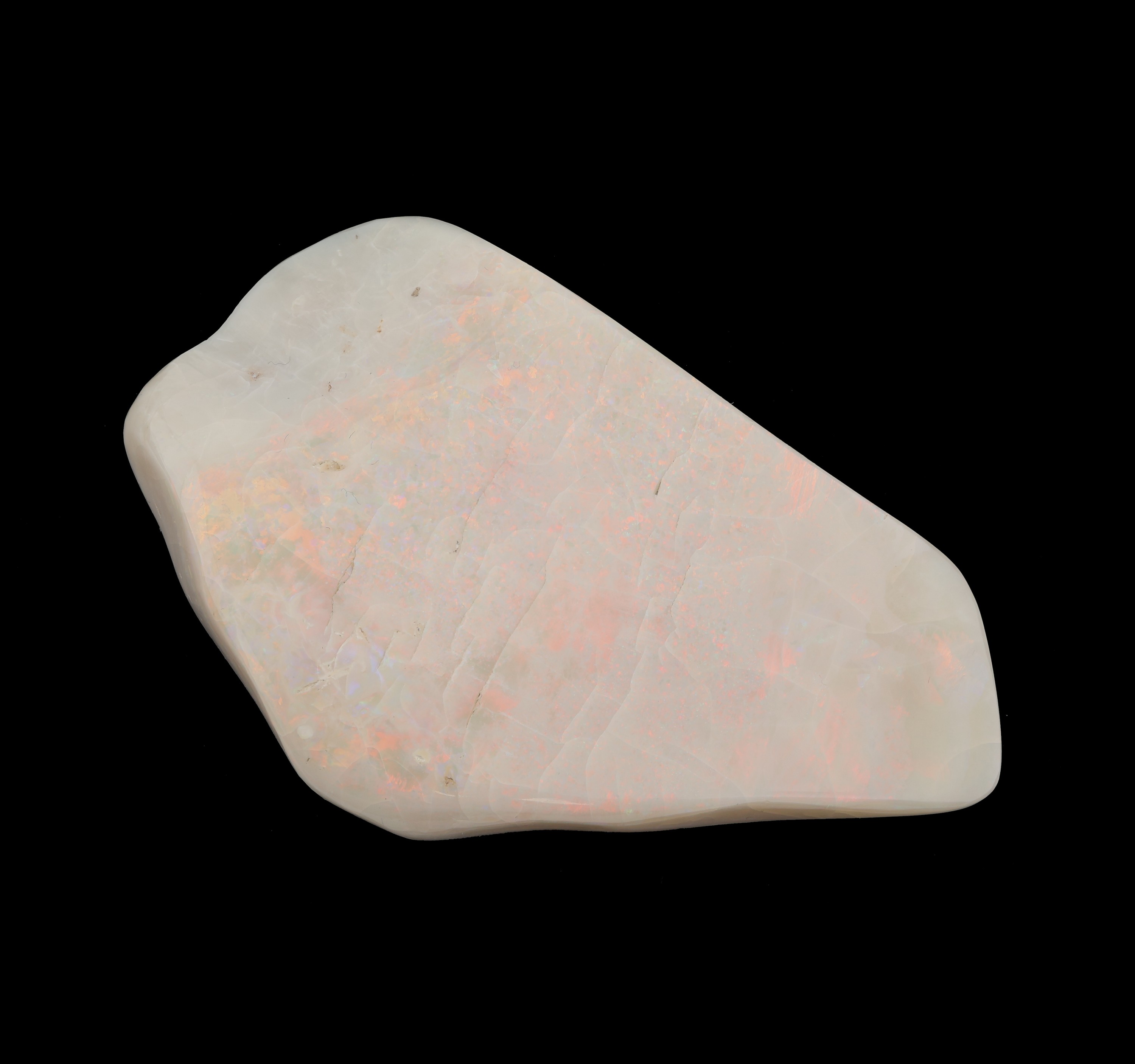Detail c: Opal-Briefbeschwerer, Vollopal, ca. 739.55 ct, Farbspiel in Rot, Gelb, Grün und Blau, ca.11.5 x 7 cm, stark trockenrissig