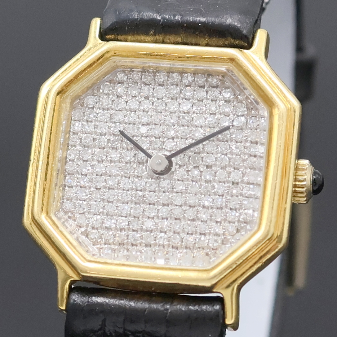 Detail a: Damenschmuckuhr in GG 750/000, Schweiz um 1975, Handaufzug, Boden aufgedr., Schmuckkrone, facett. Glas, WG-Zifferbl. m. Diamanten bes. (Pavee), ...