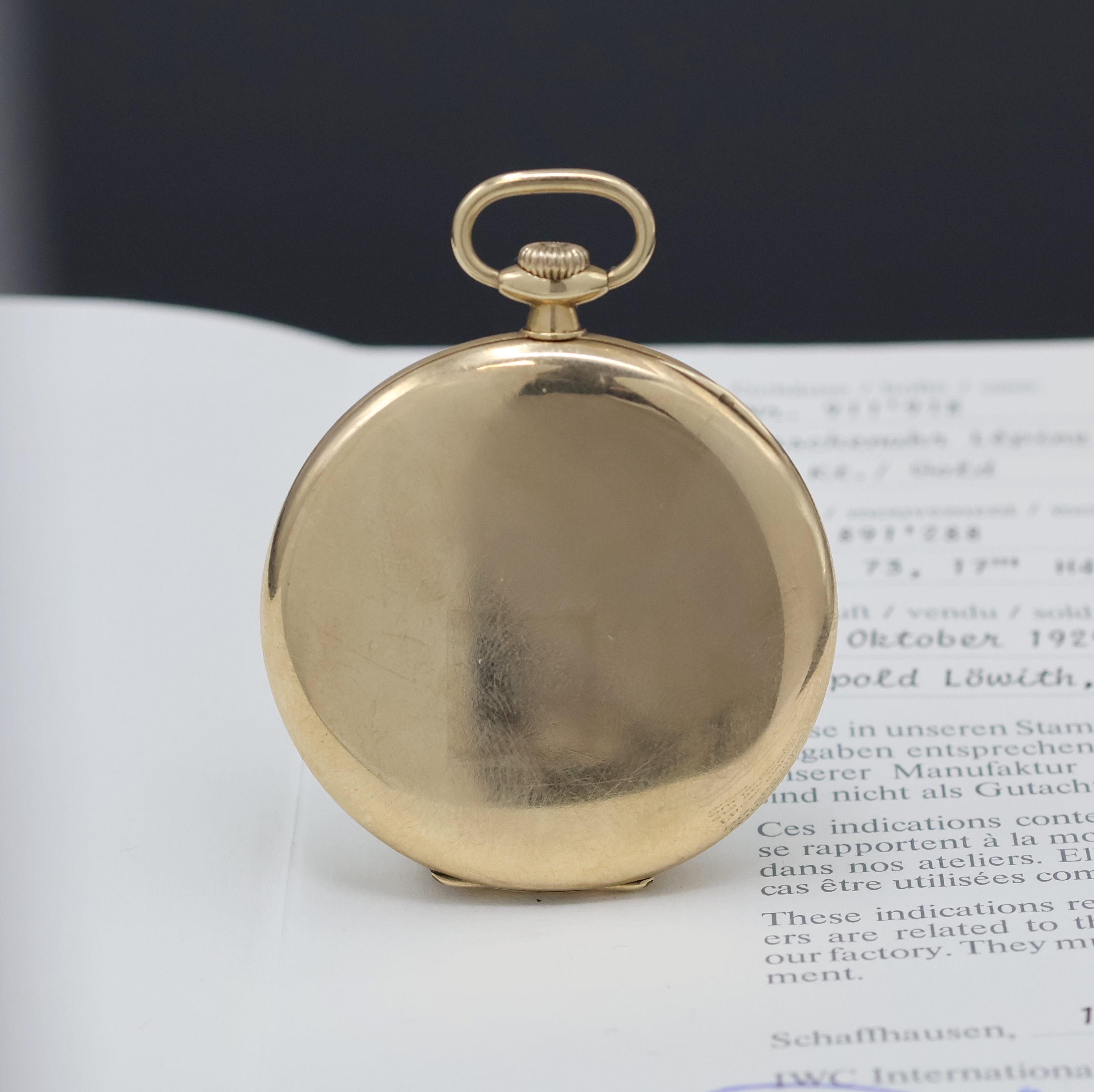 Detail a: IWC offene Herrentaschenuhr in GG 585/000, Schweiz verk. lt. Stammbuchauszug 10/1929, glattes Geh. l. dell., Metallcuvette, gold. Zifferbl. fl., ...